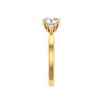 Yellow gold cluster ring with brilliant oval center stone