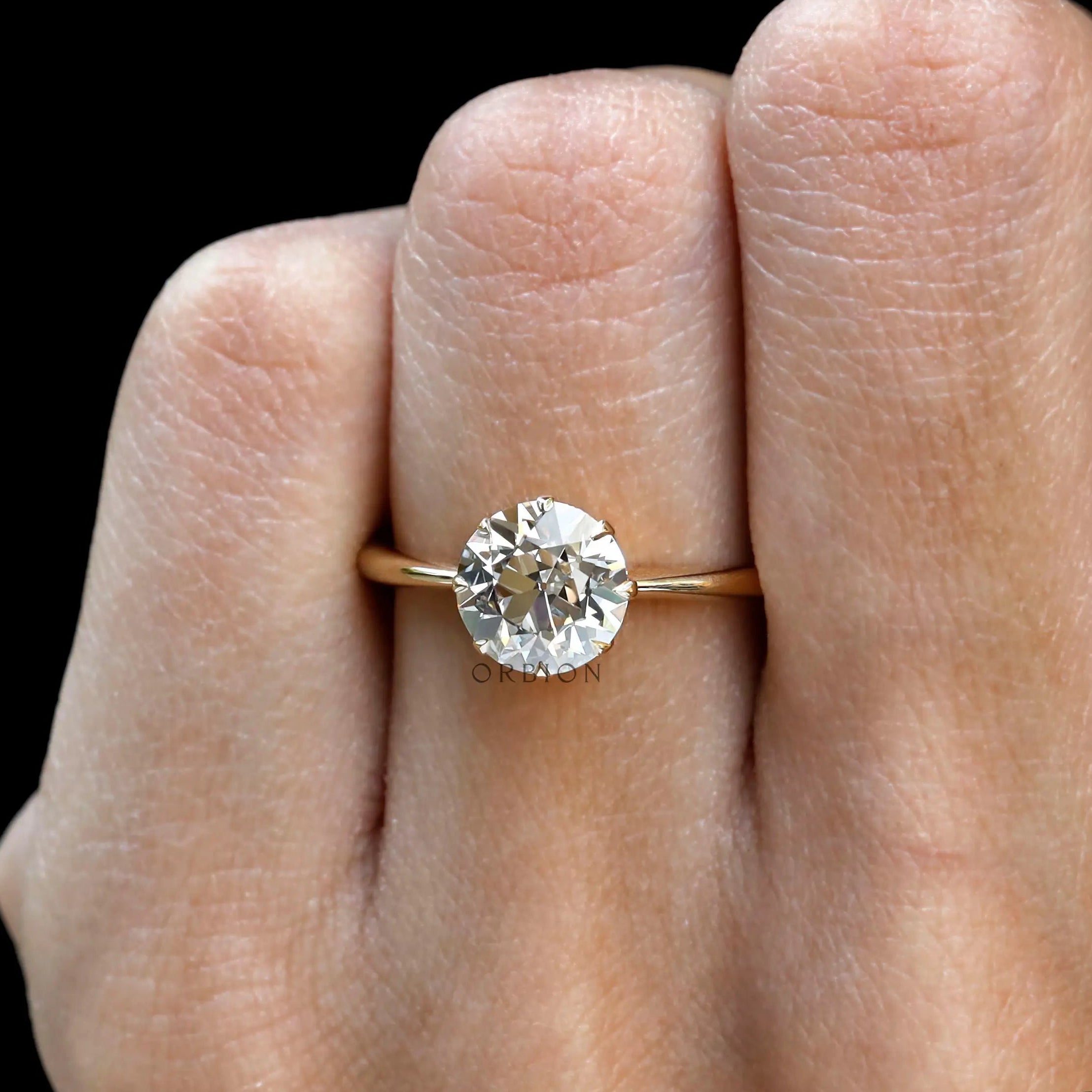 8 prong vintage style OEC engagement ring close up