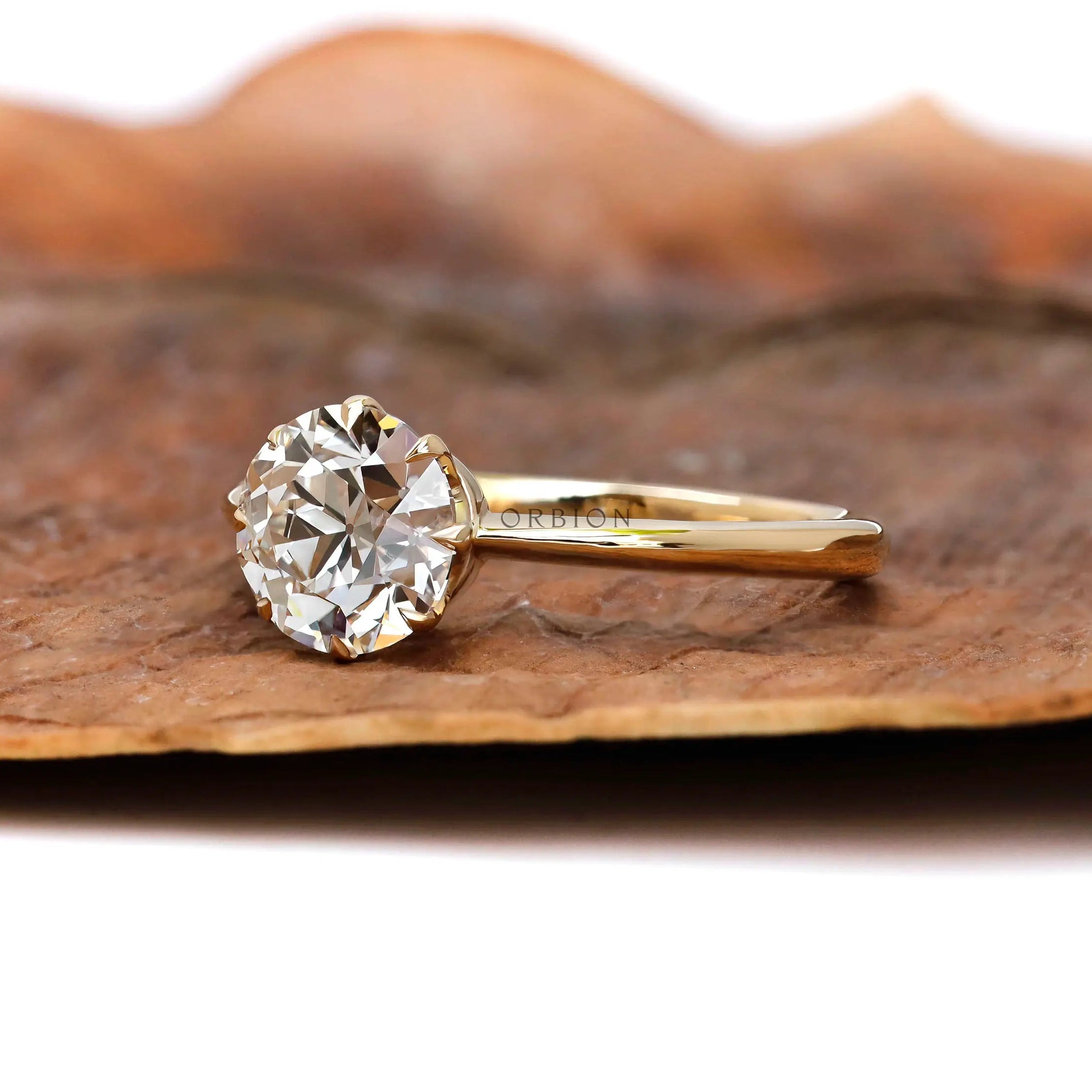 Antique inspired yellow gold solitaire engagement ring