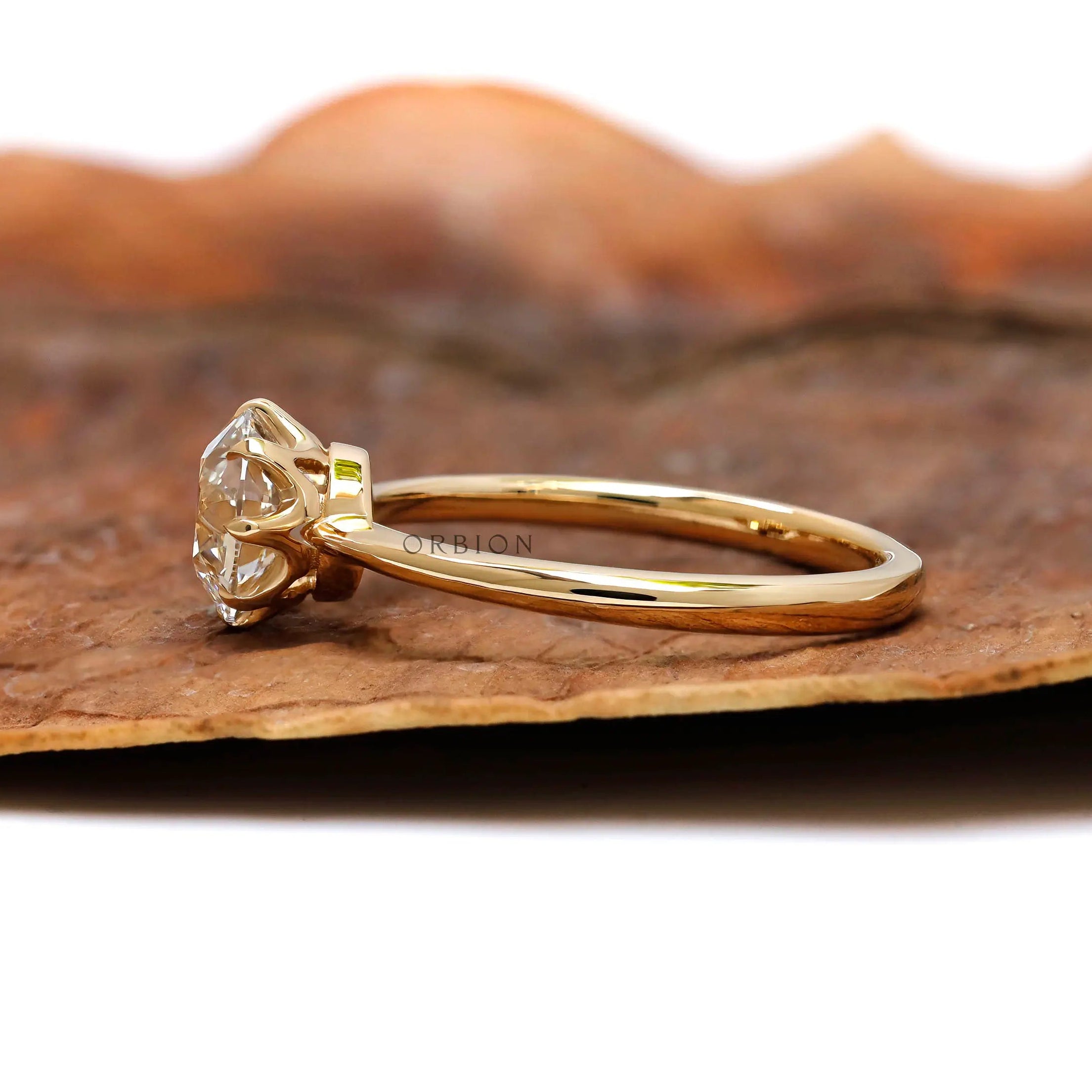 Side profile of 8 prong round OEC diamond ring
