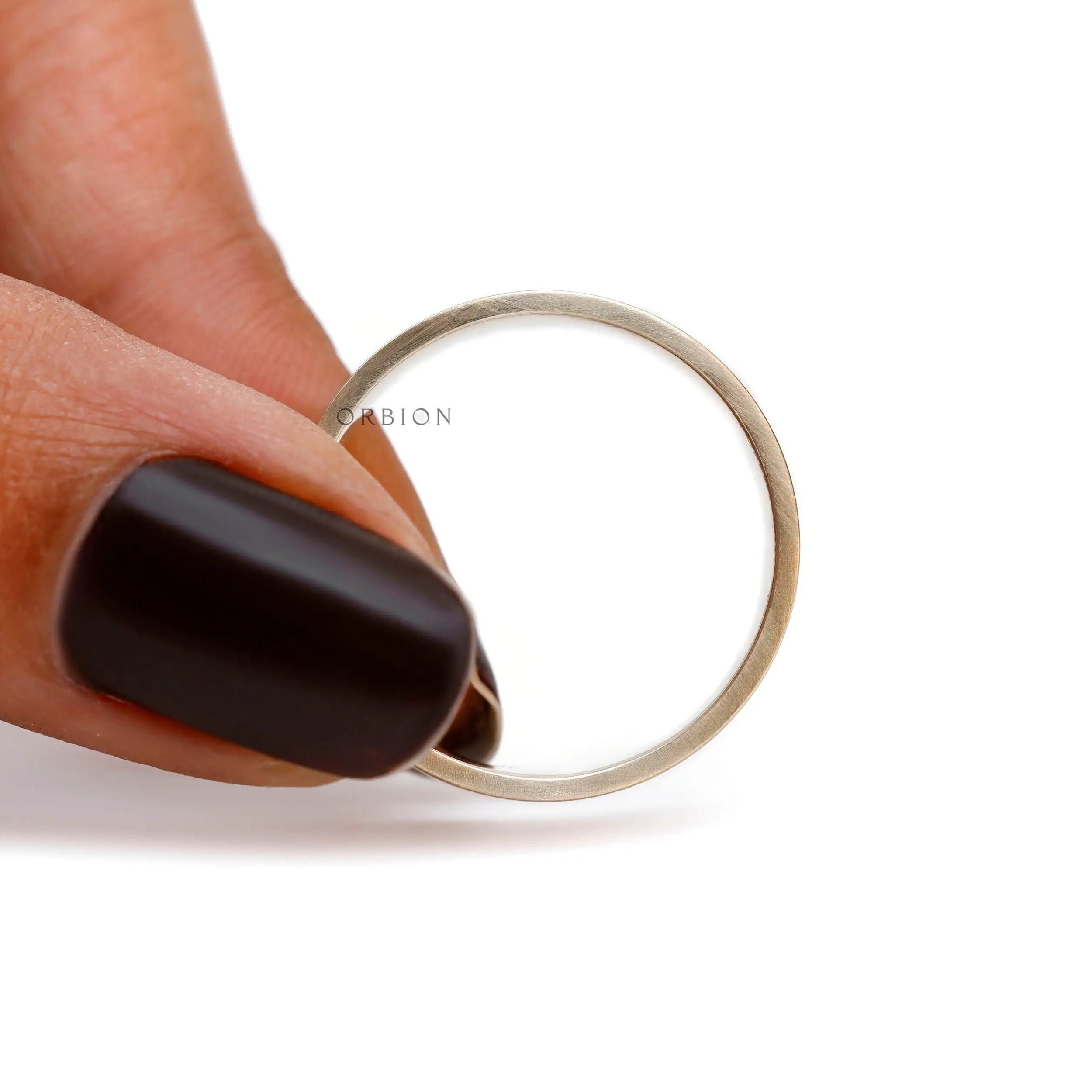 10K yellow gold plain wedding band on hand lifestyle image