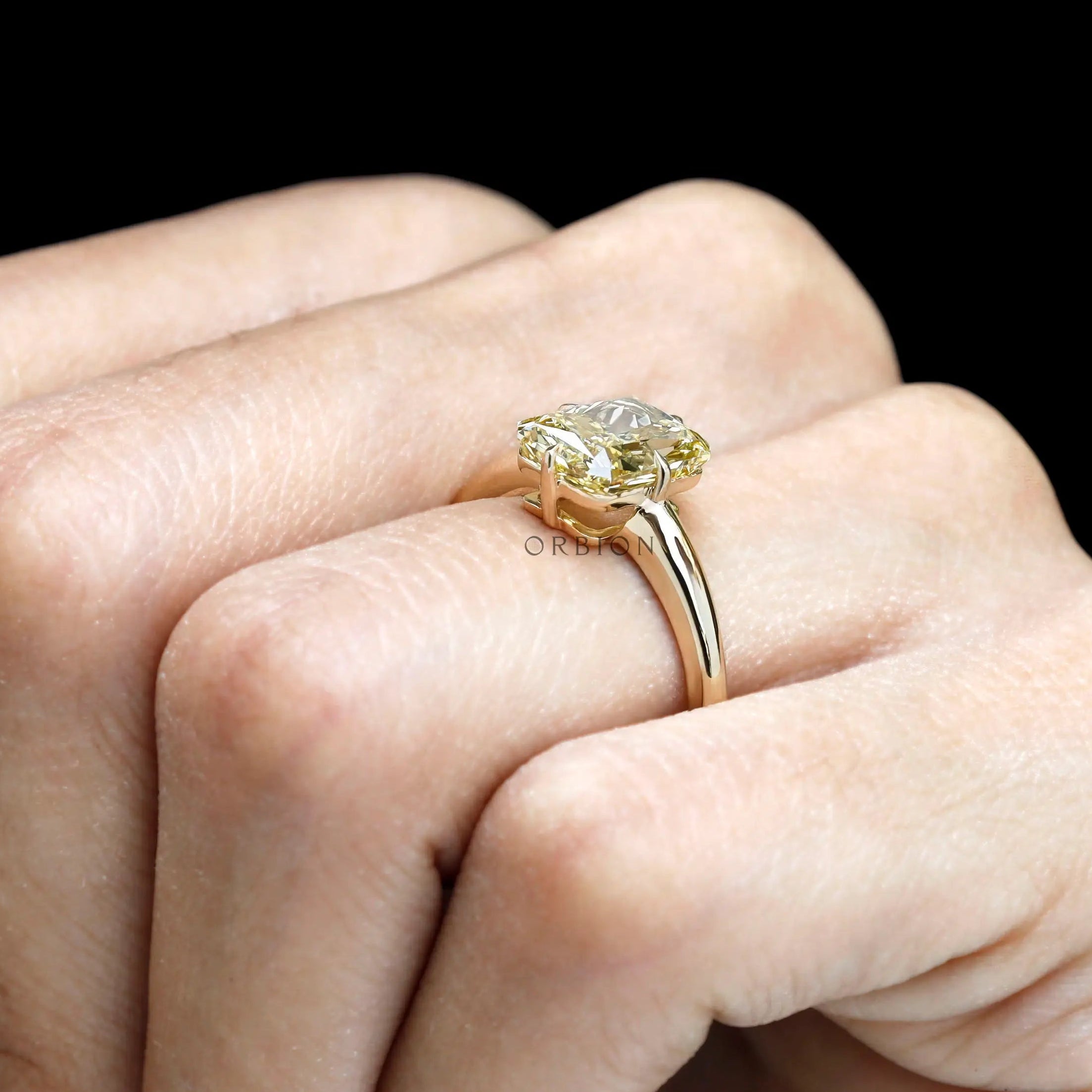 Fancy yellow diamond ring on hand