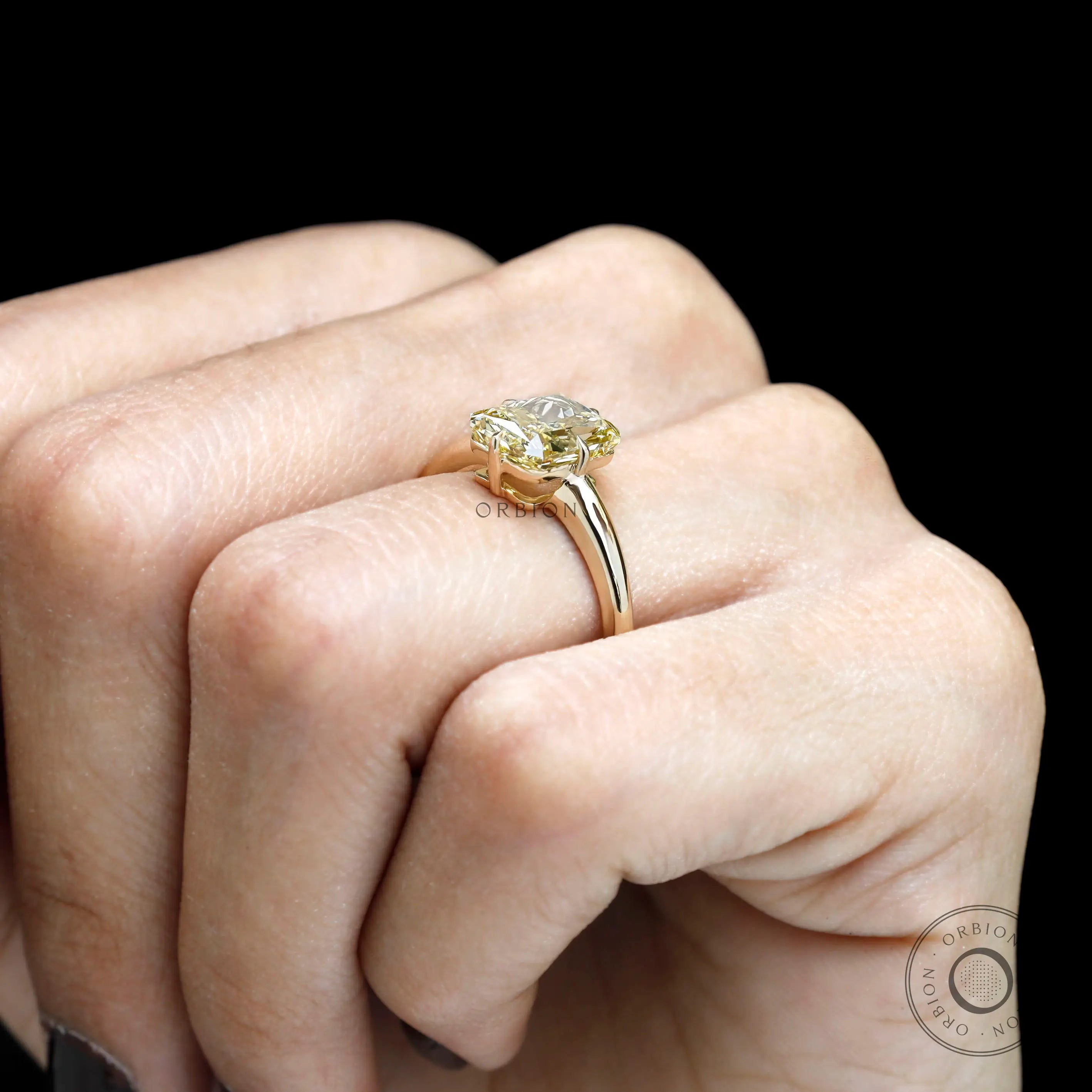 Fancy yellow diamond ring on hand