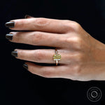 Tapered gold band with radiant center stone detail