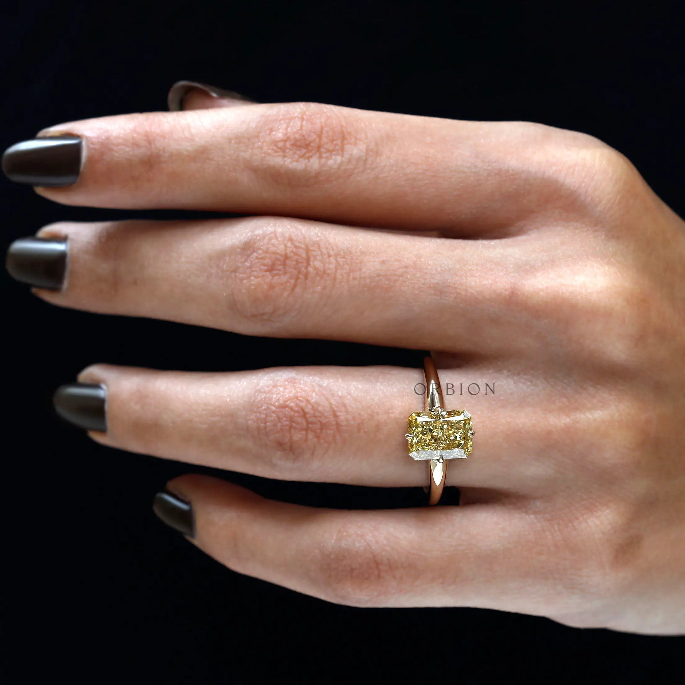 Tapered gold band with radiant center stone detail