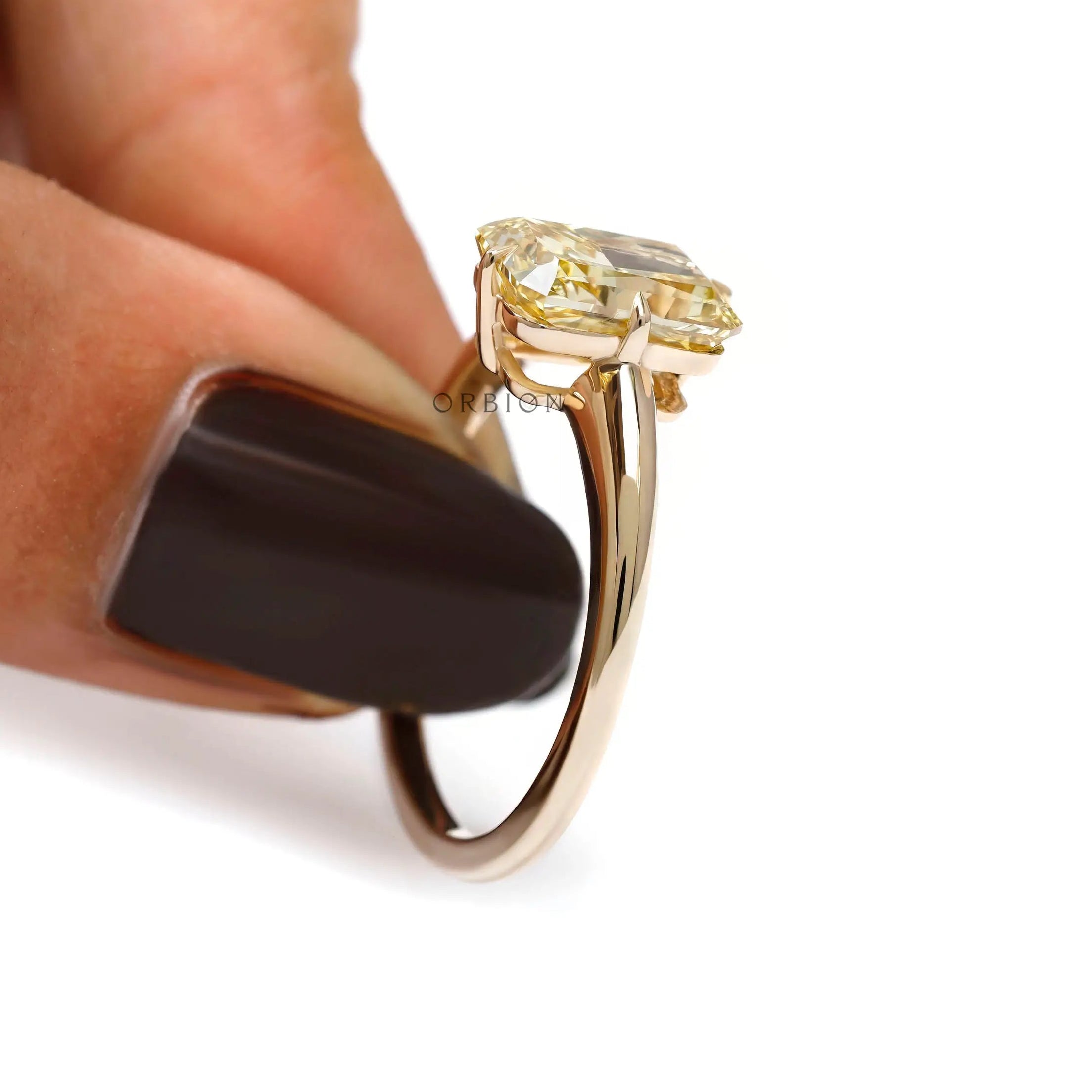 Radiant cut yellow diamond solitaire ring