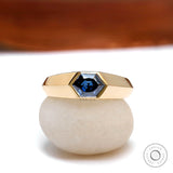 Men’s hexagon deep blue moissanite signet ring in 18K yellow gold front view  