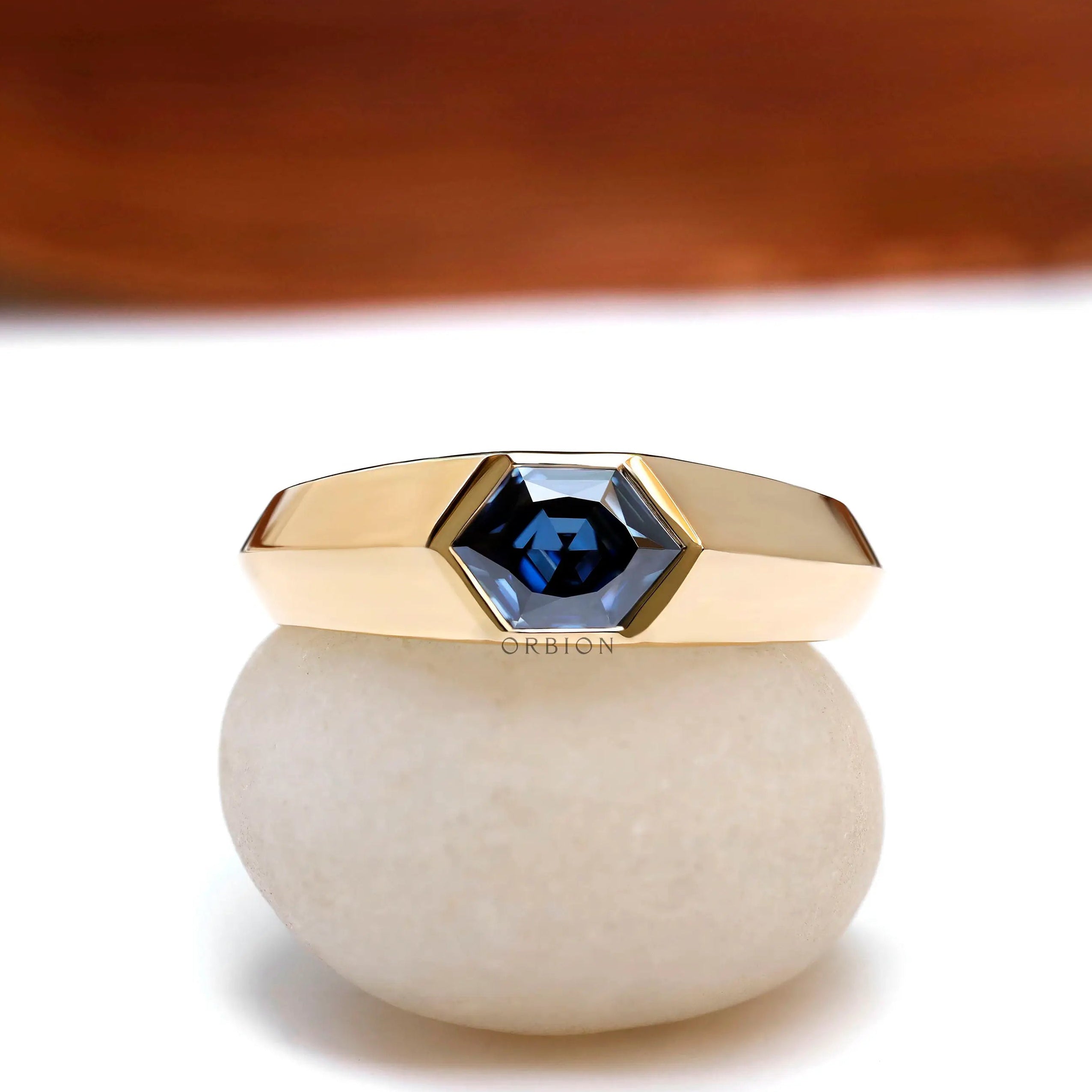 Men’s hexagon deep blue moissanite signet ring in 18K yellow gold front view  