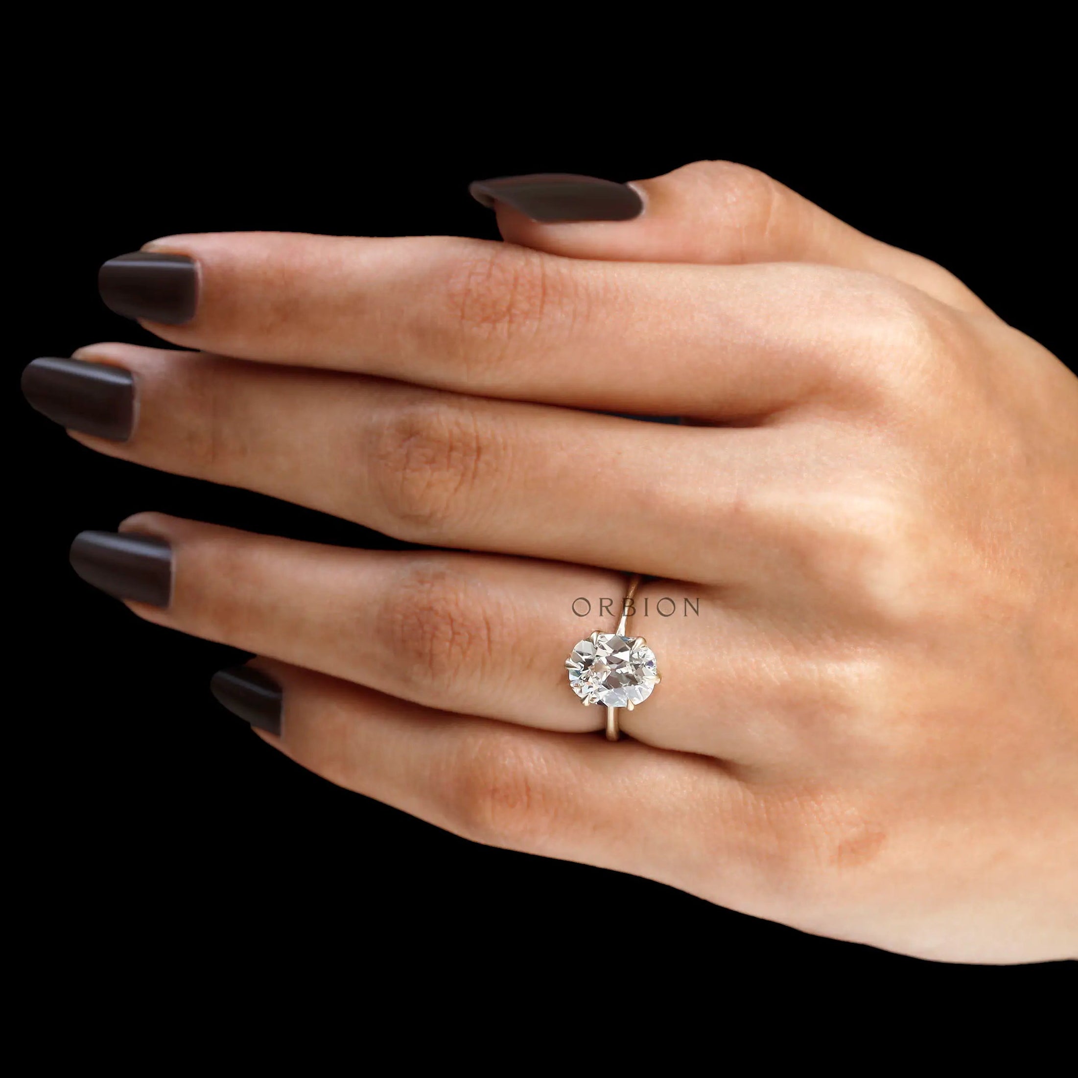 Vintage style lab diamond solitaire ring on finger
