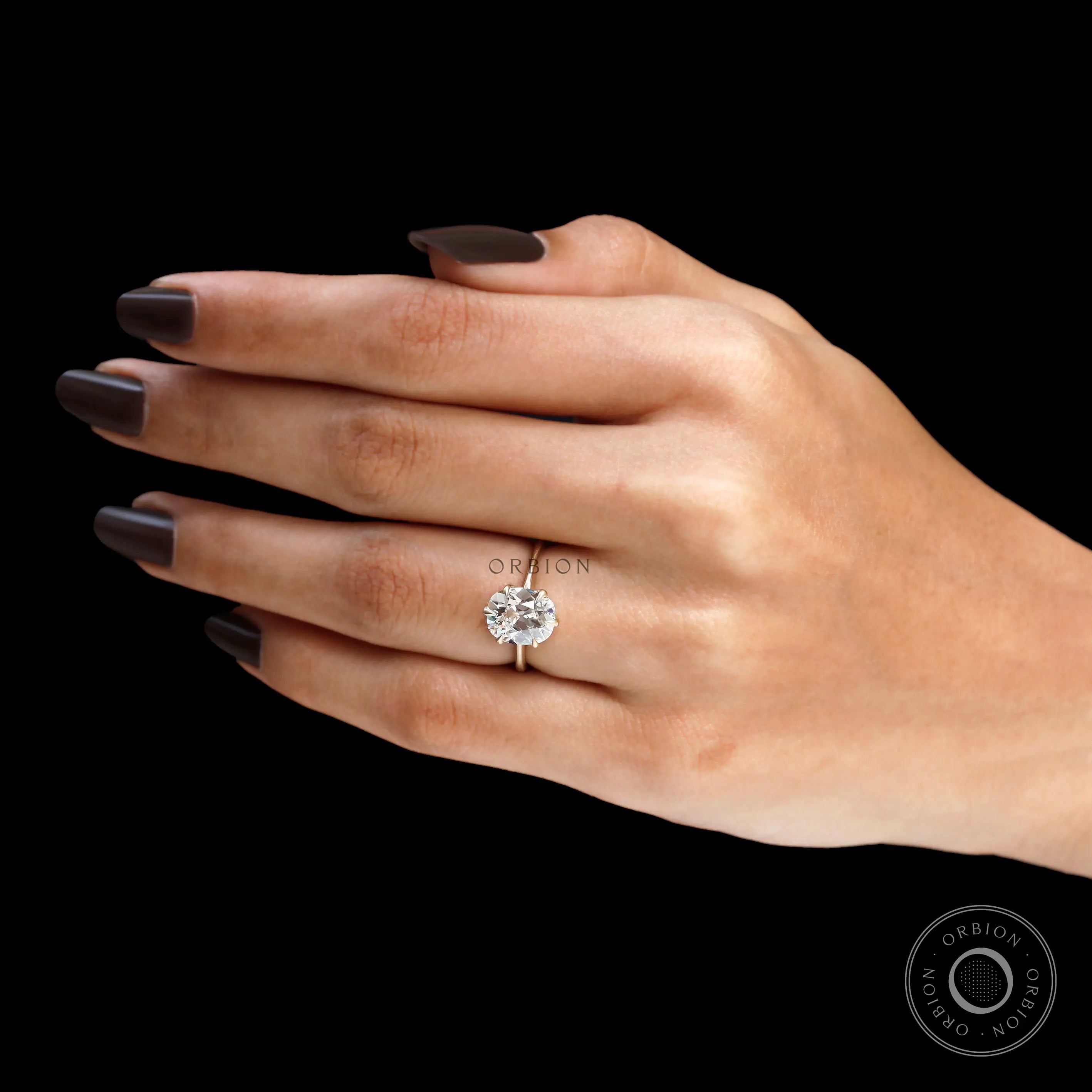 Vintage style lab diamond solitaire ring on finger