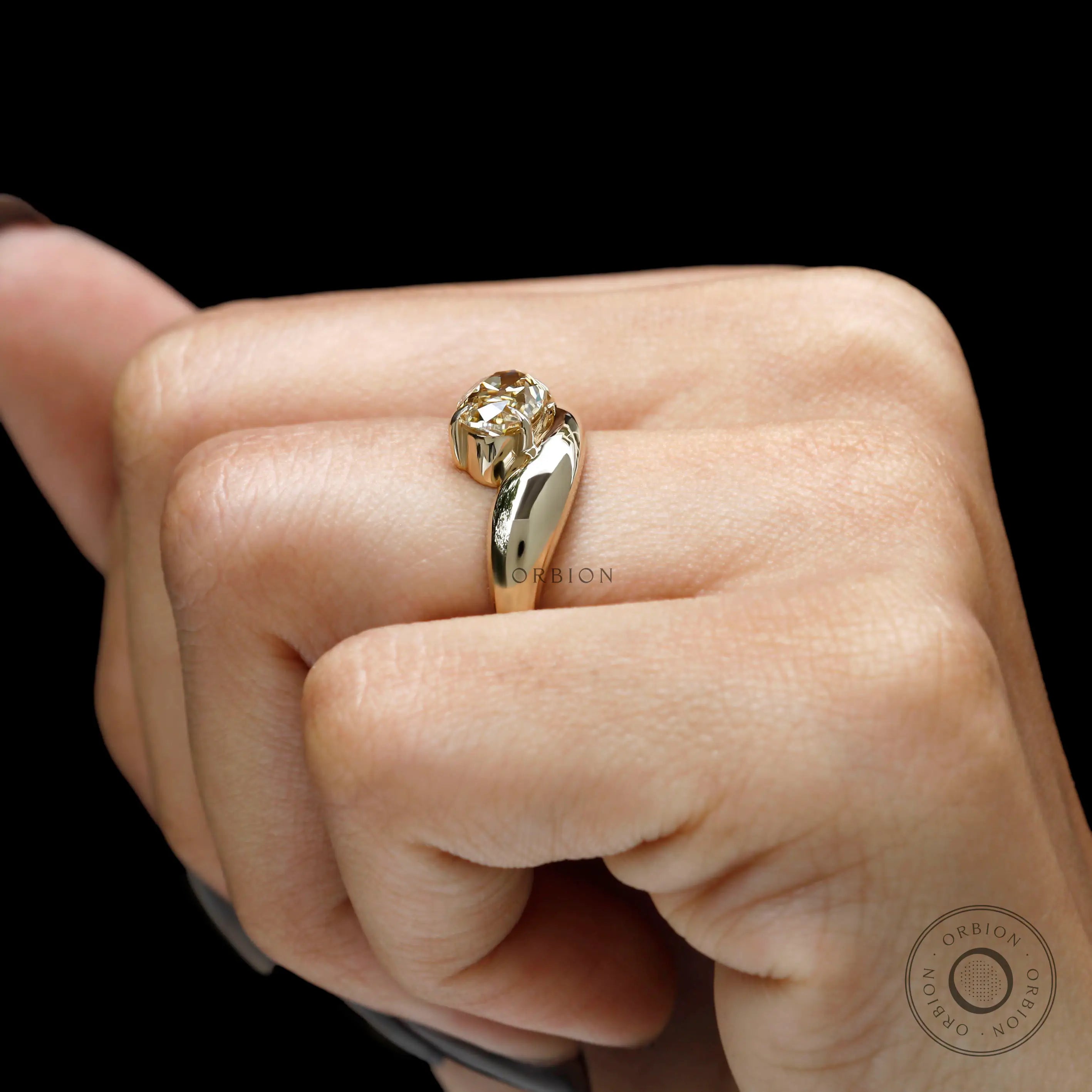 chunky wave gold engagement ring with oval champagne moissanite