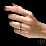 Contemporary wave inspired moissanite thick band engagement ring on finger