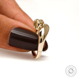 10K yellow gold oval solitaire engagement ring lifestyle hand shot