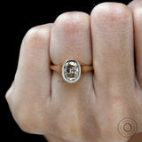 Warm tone champagne moissanite solitaire ring close up