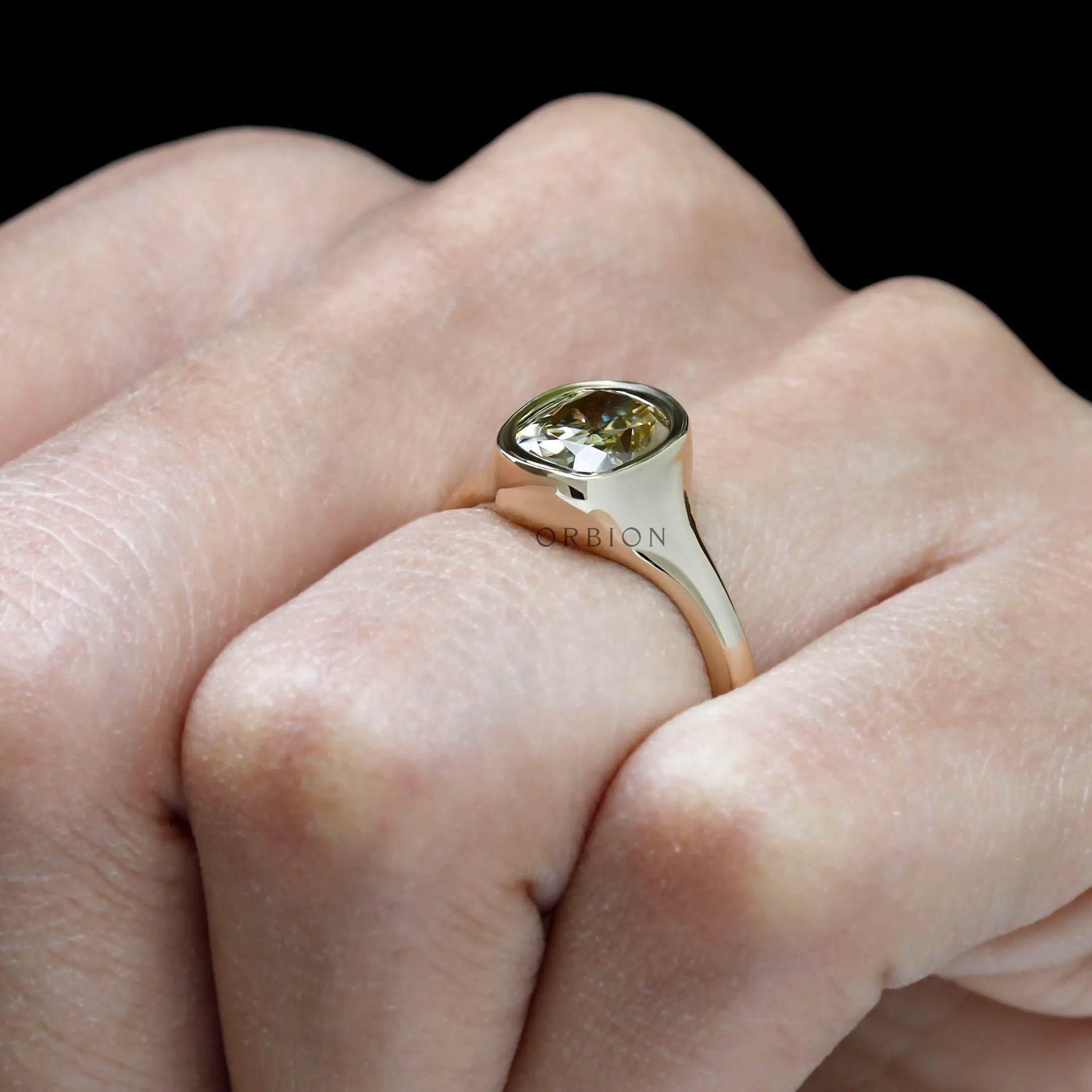 Simple yet bold signet style engagement ring in yellow gold