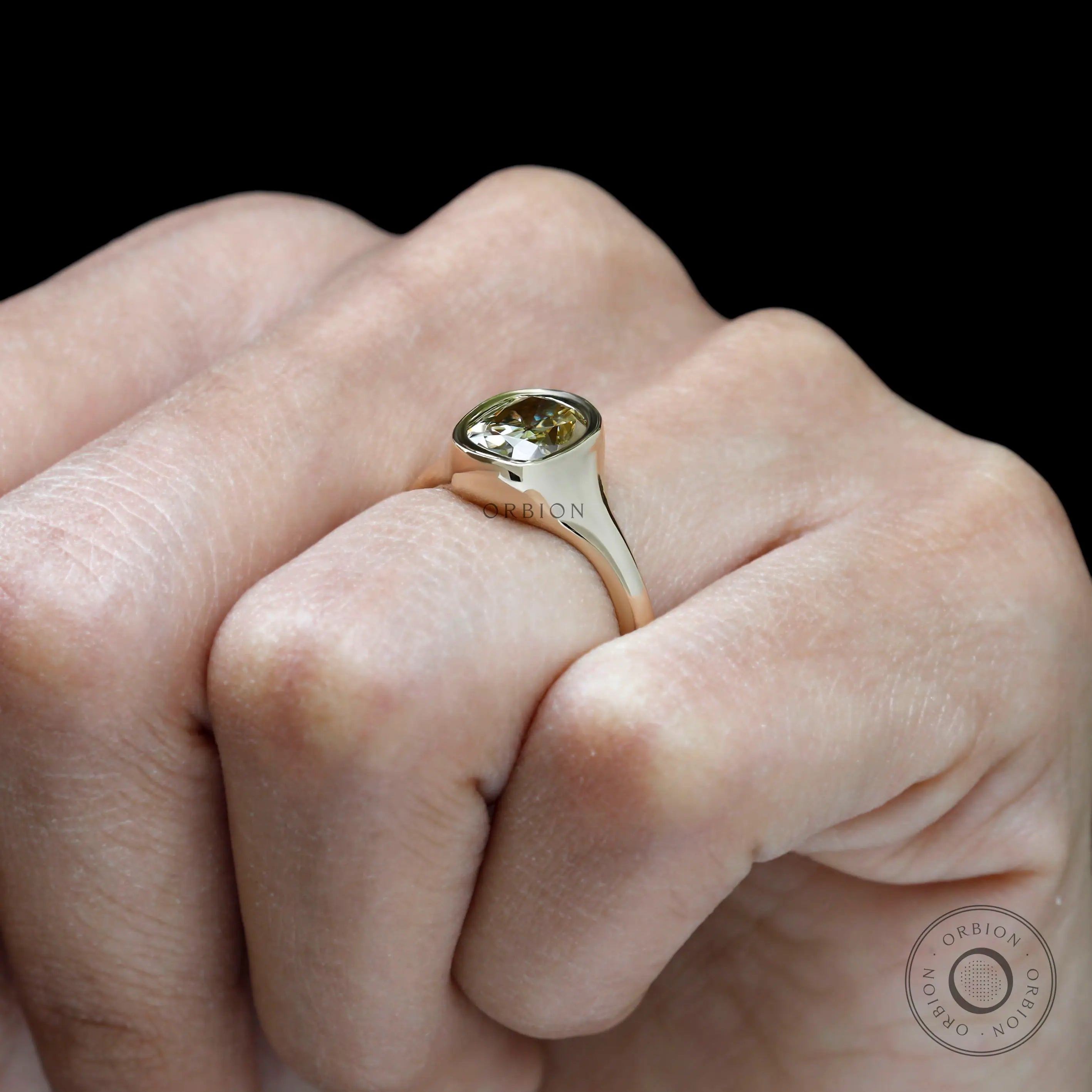 Simple yet bold signet style engagement ring in yellow gold