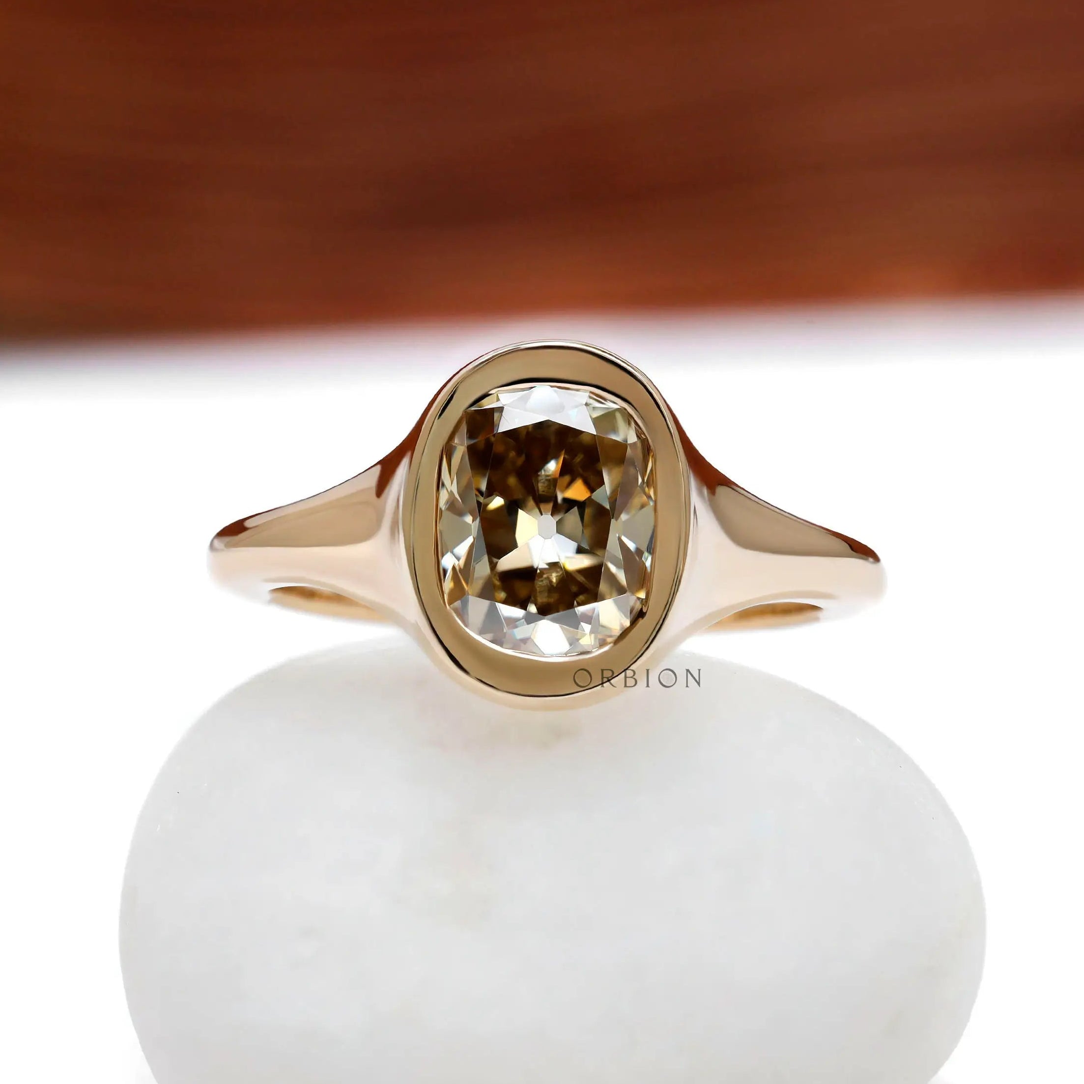 Old mine cut yellowish champagne moissanite signet engagement ring