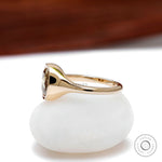 Bezel set elongated cushion champagne moissanite ring in 10k yellow gold