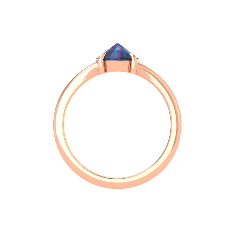 Minimalist 10K rose gold solitaire with deep blue center stone