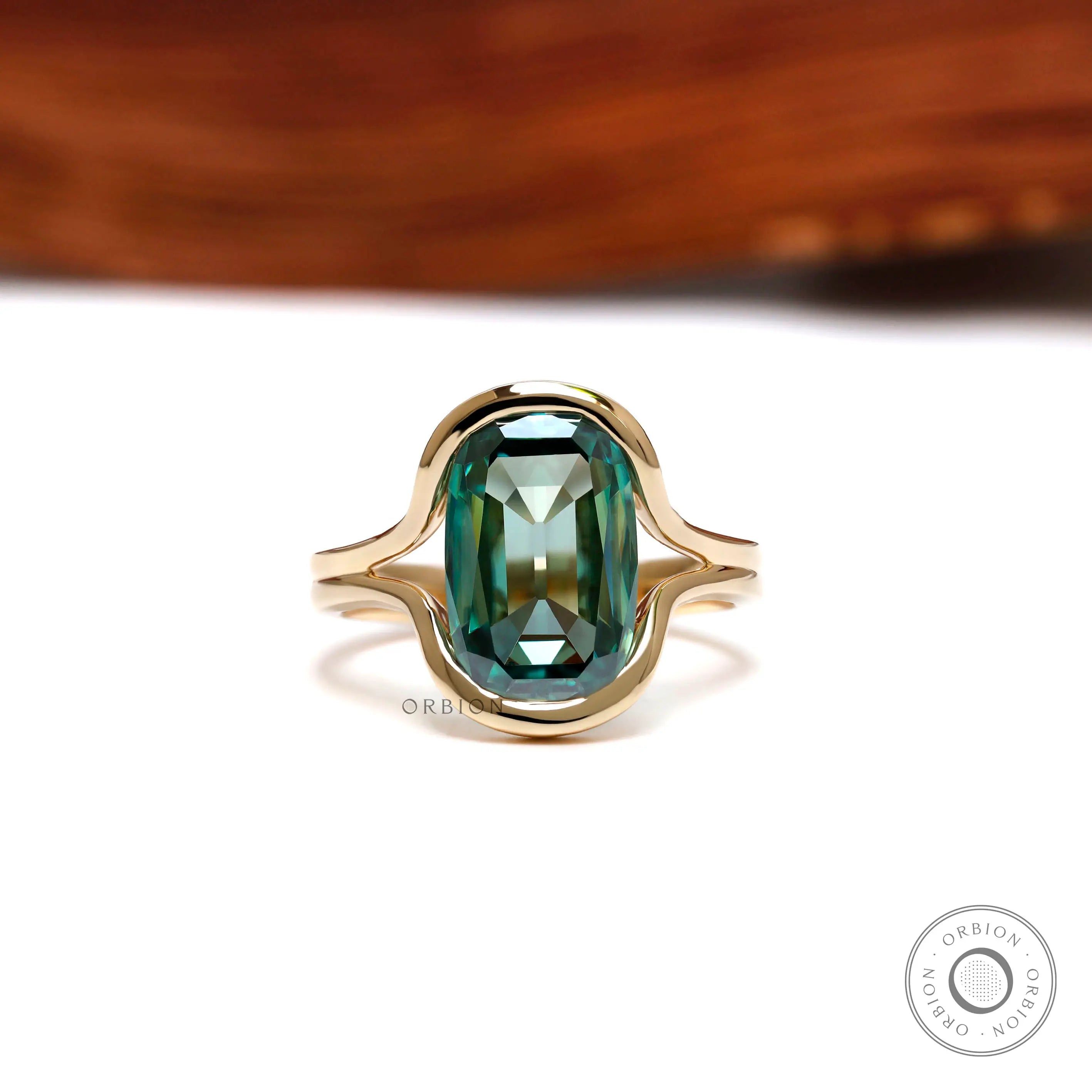Front view of green moissanite floating half bezel ring