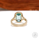 Back view of elongated cushion green moissanite gold ring
