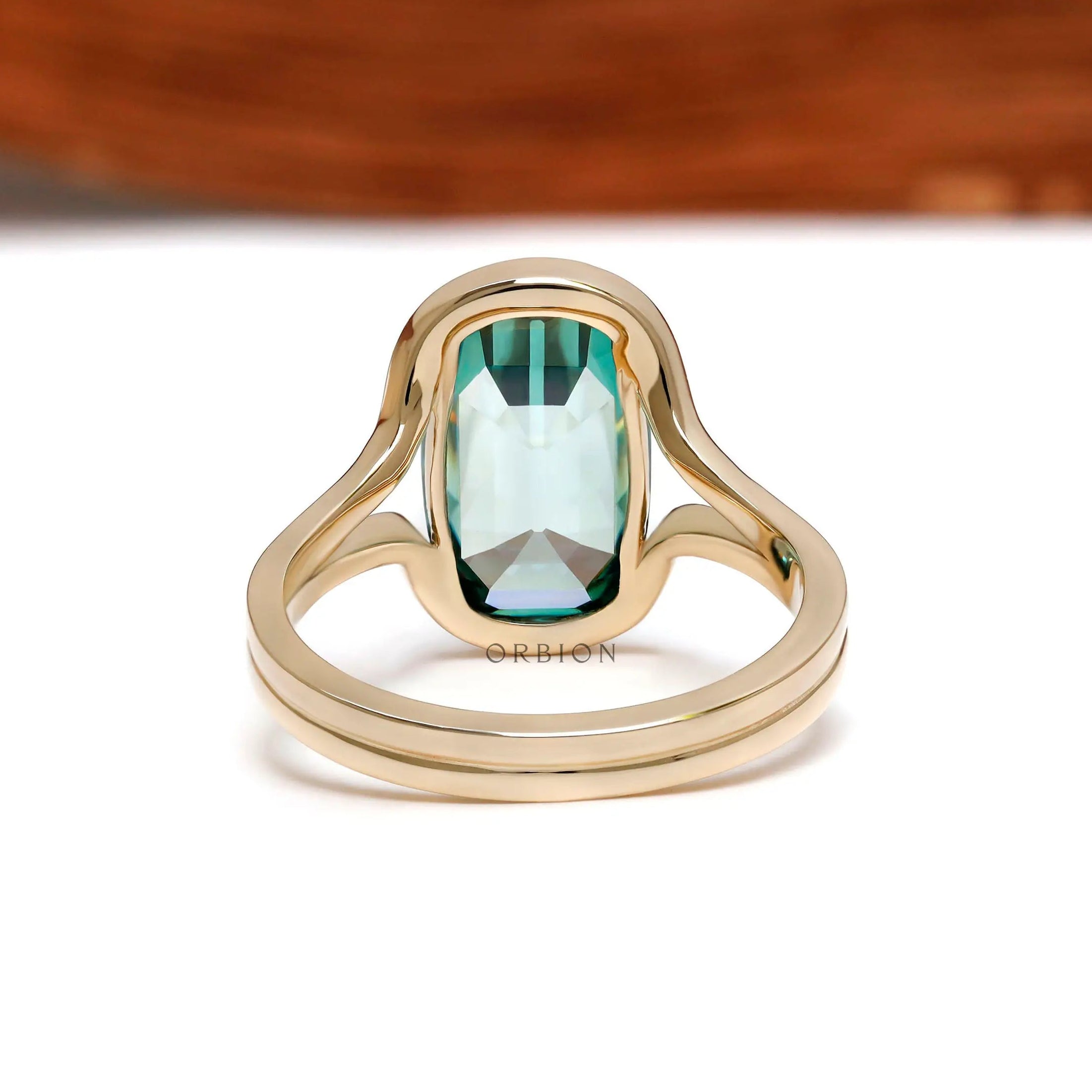 Back view of elongated cushion green moissanite gold ring