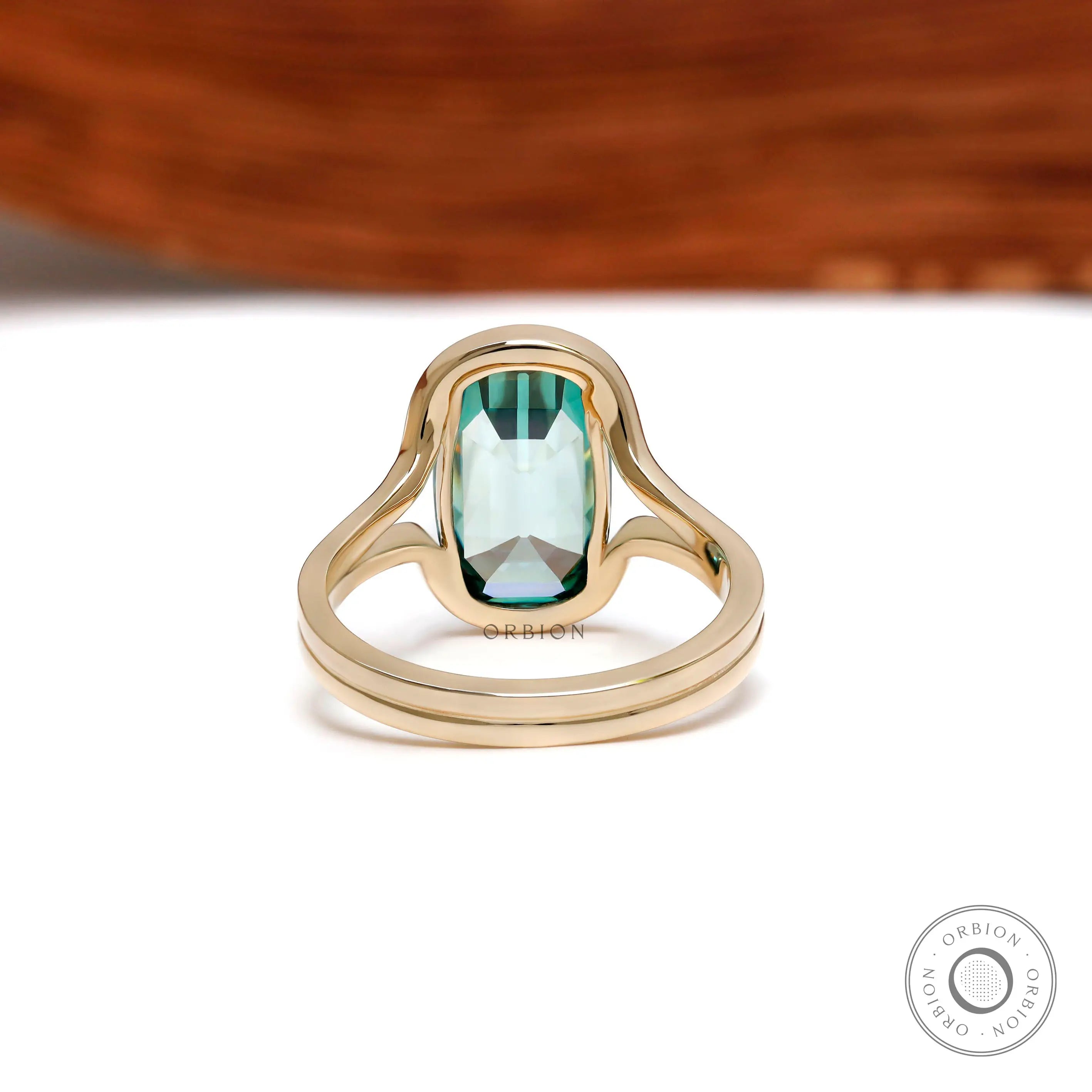Back view of elongated cushion green moissanite gold ring
