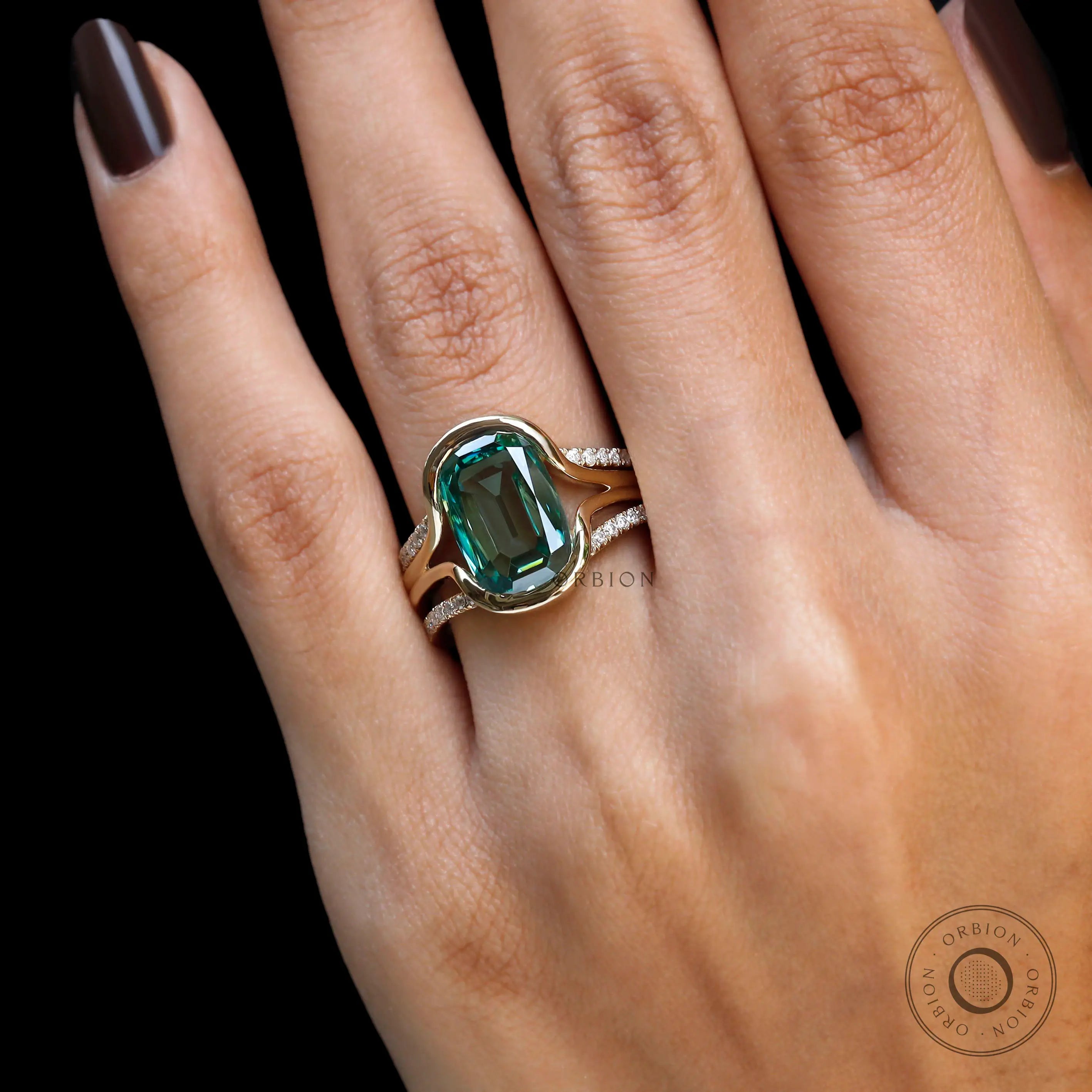 Close view of elongated cushion green moissanite ring set worn on hand