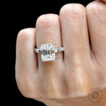 emerald cut ring with accent stones close up