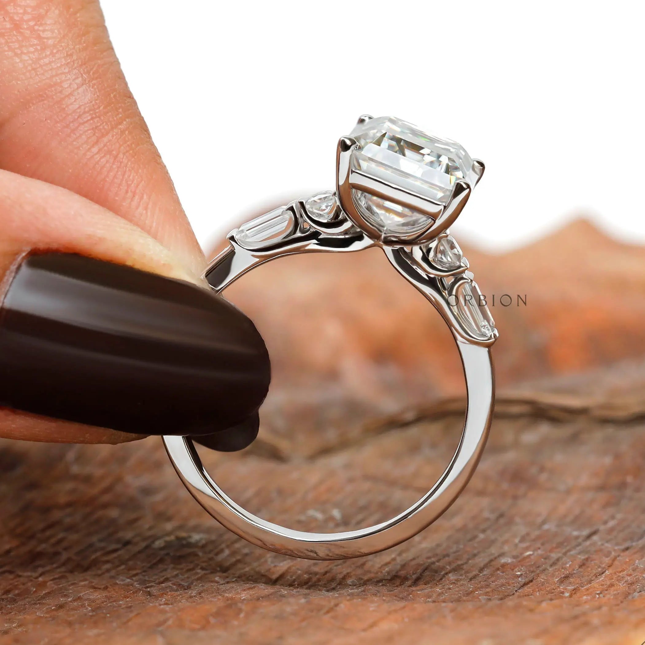 Emerald cut lab diamond solitaire ring in 14k white gold