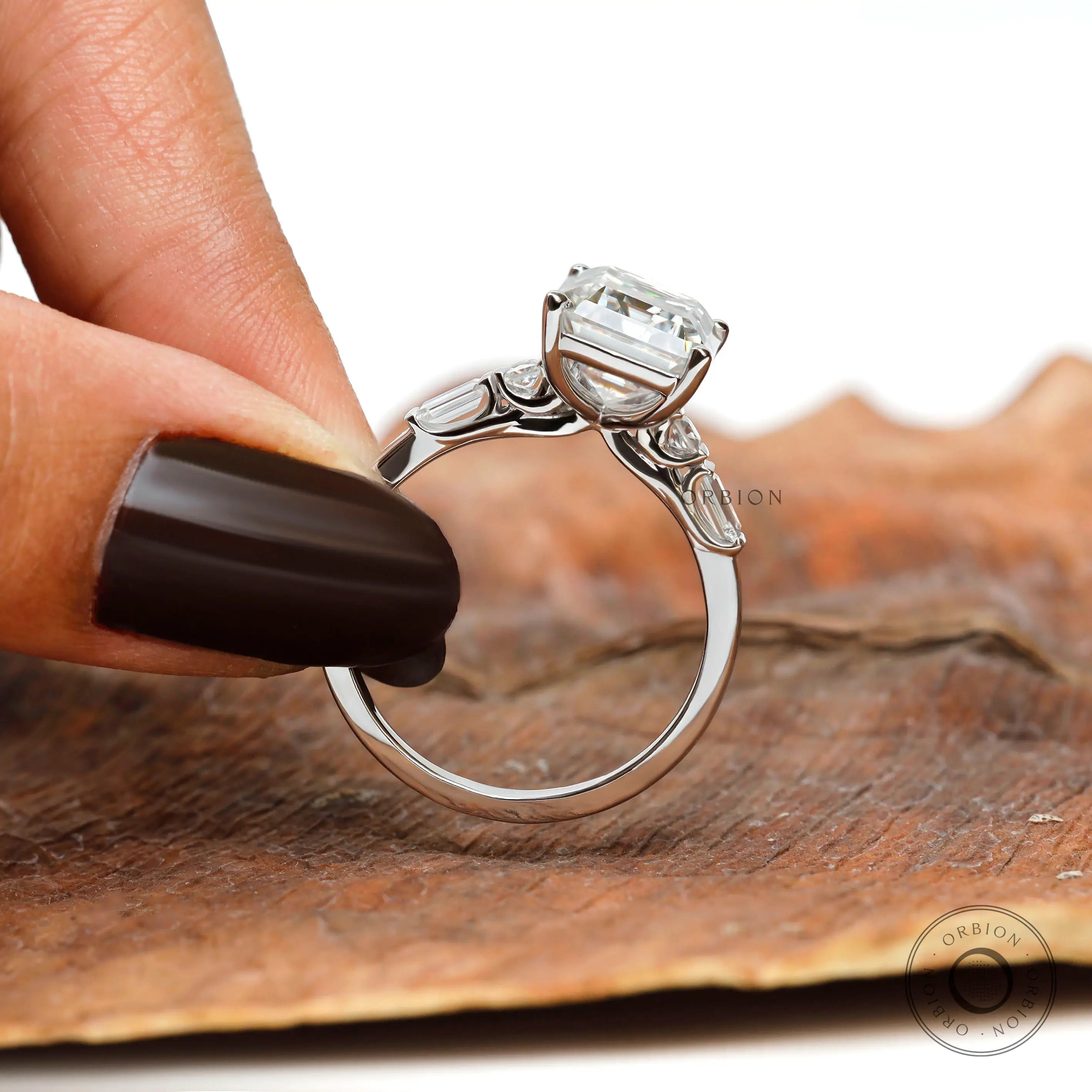 Emerald cut lab diamond solitaire ring in 14k white gold