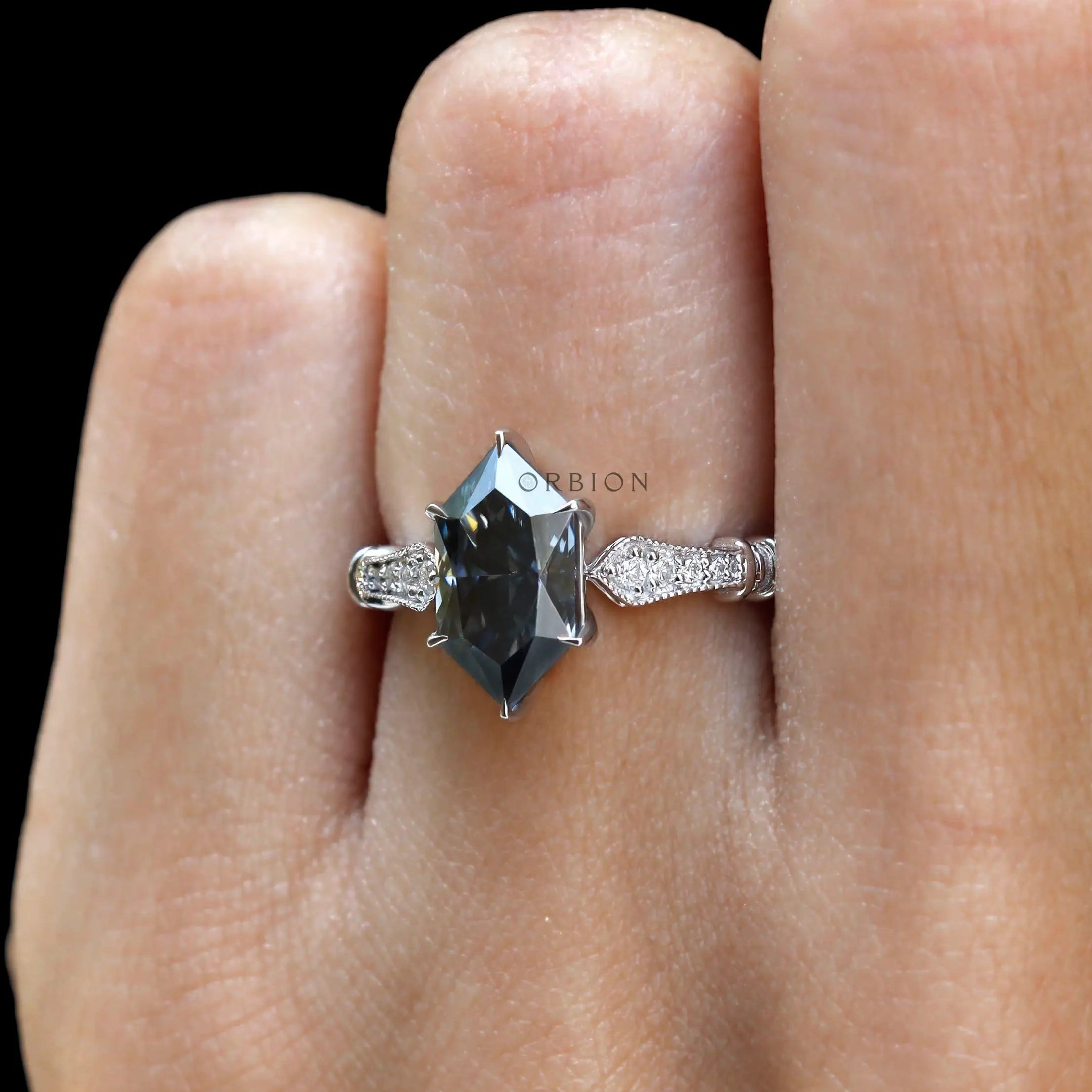 Color moissanite engagement ring close up