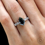 Dark grey hexagon moissanite ring on hand close up