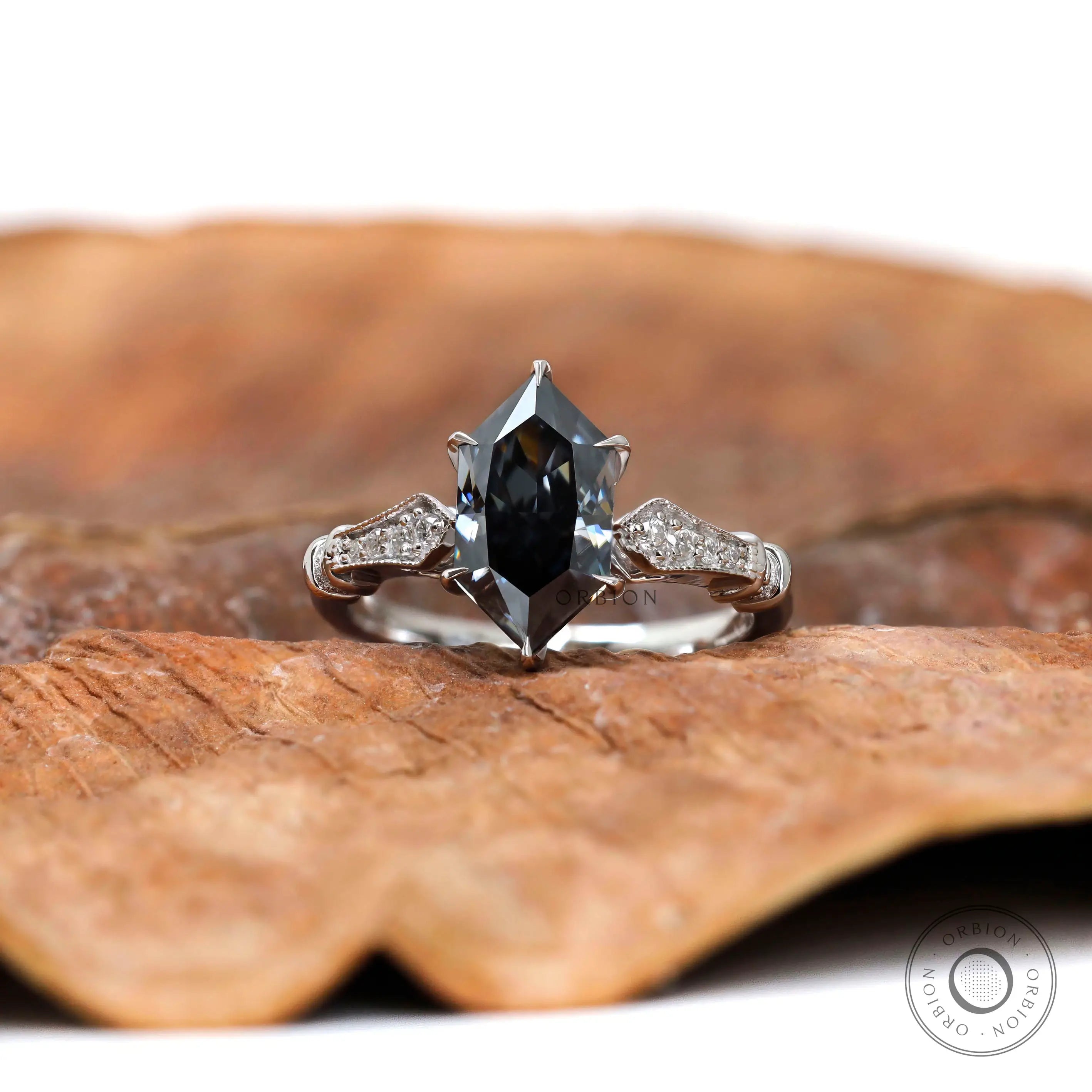 Hexagon step cut dark grey moissanite engagement ring in 14k white gold