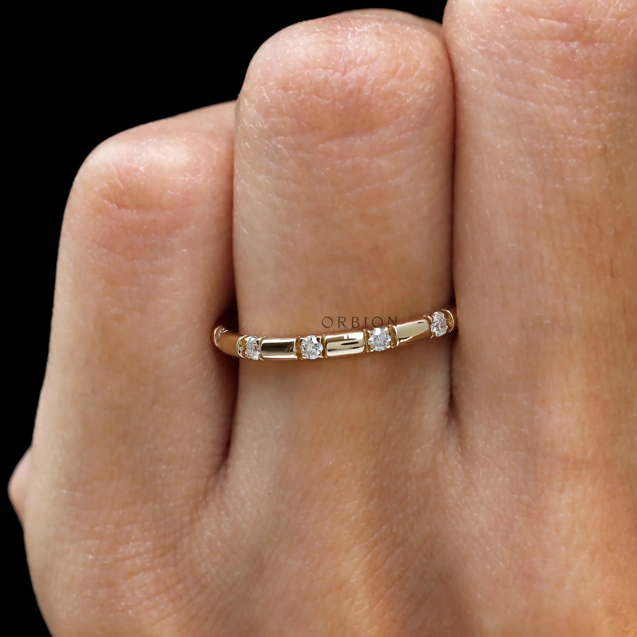 Round moissanite distance stacking band yellow gold