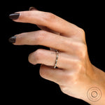 Contemporary station style eternity ring studio shot