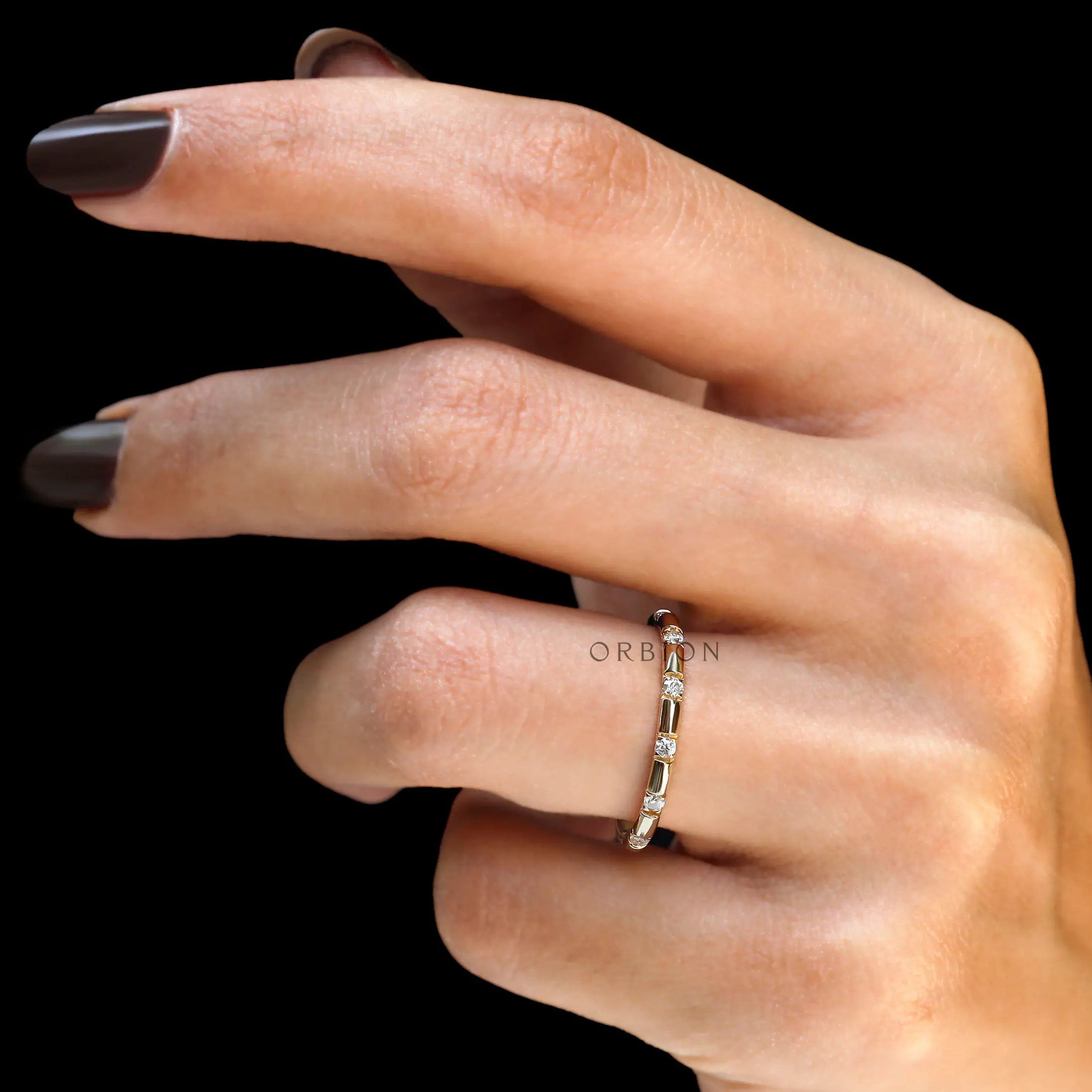 Contemporary station style eternity ring studio shot