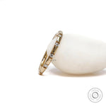 14K yellow gold eternity wedding band modern station design