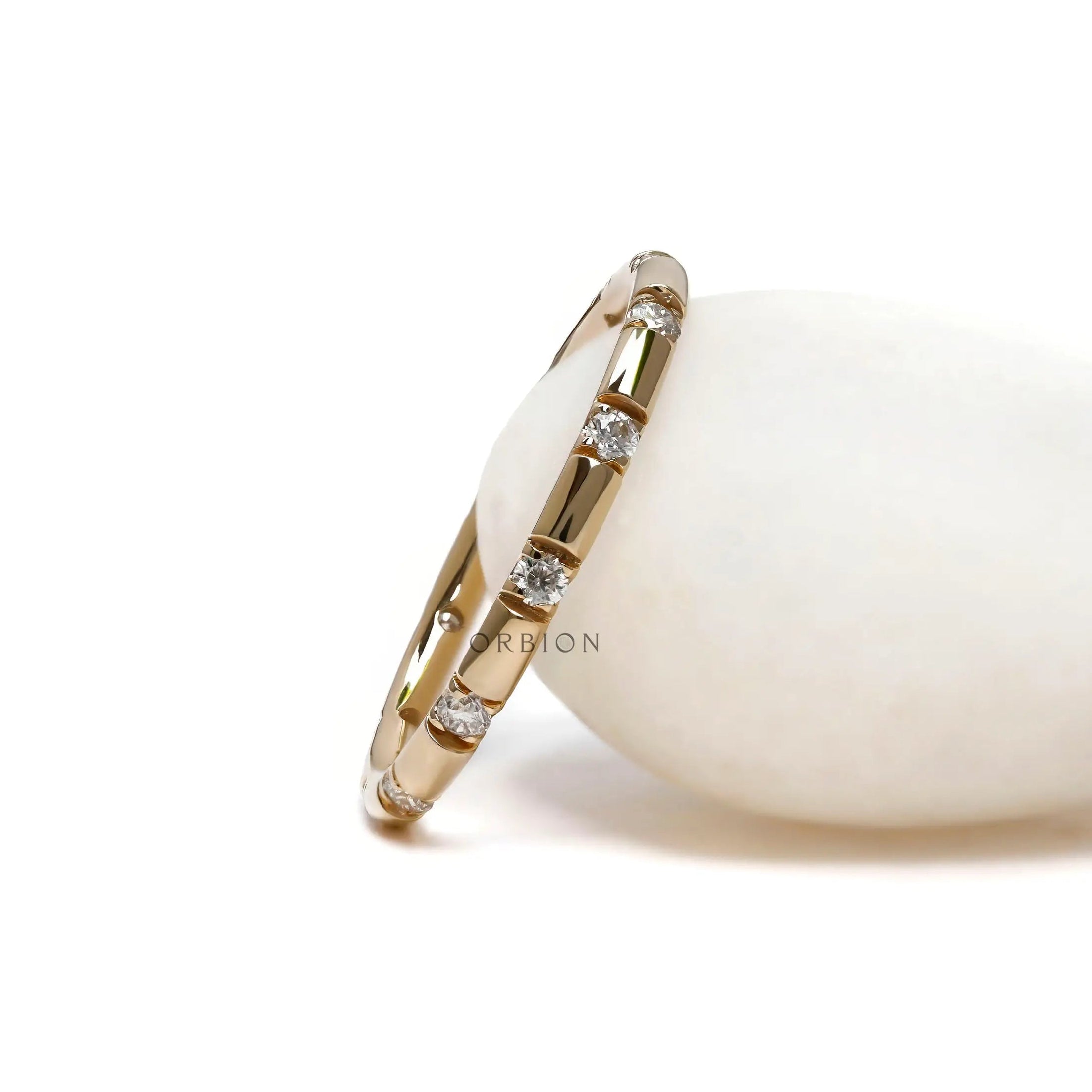 14K yellow gold eternity wedding band modern station design