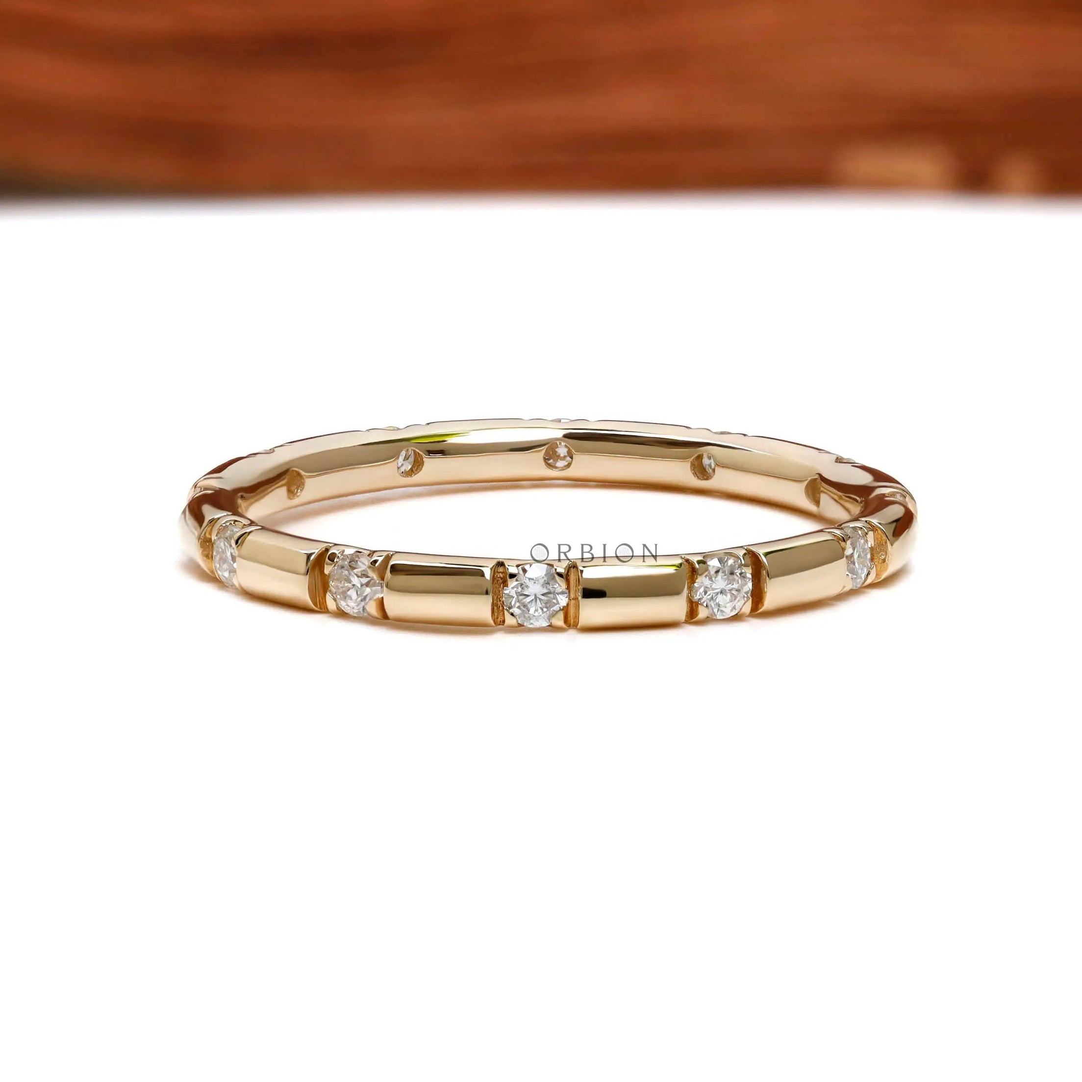 2 mm lab diamond stacking band with round brilliant stones close up