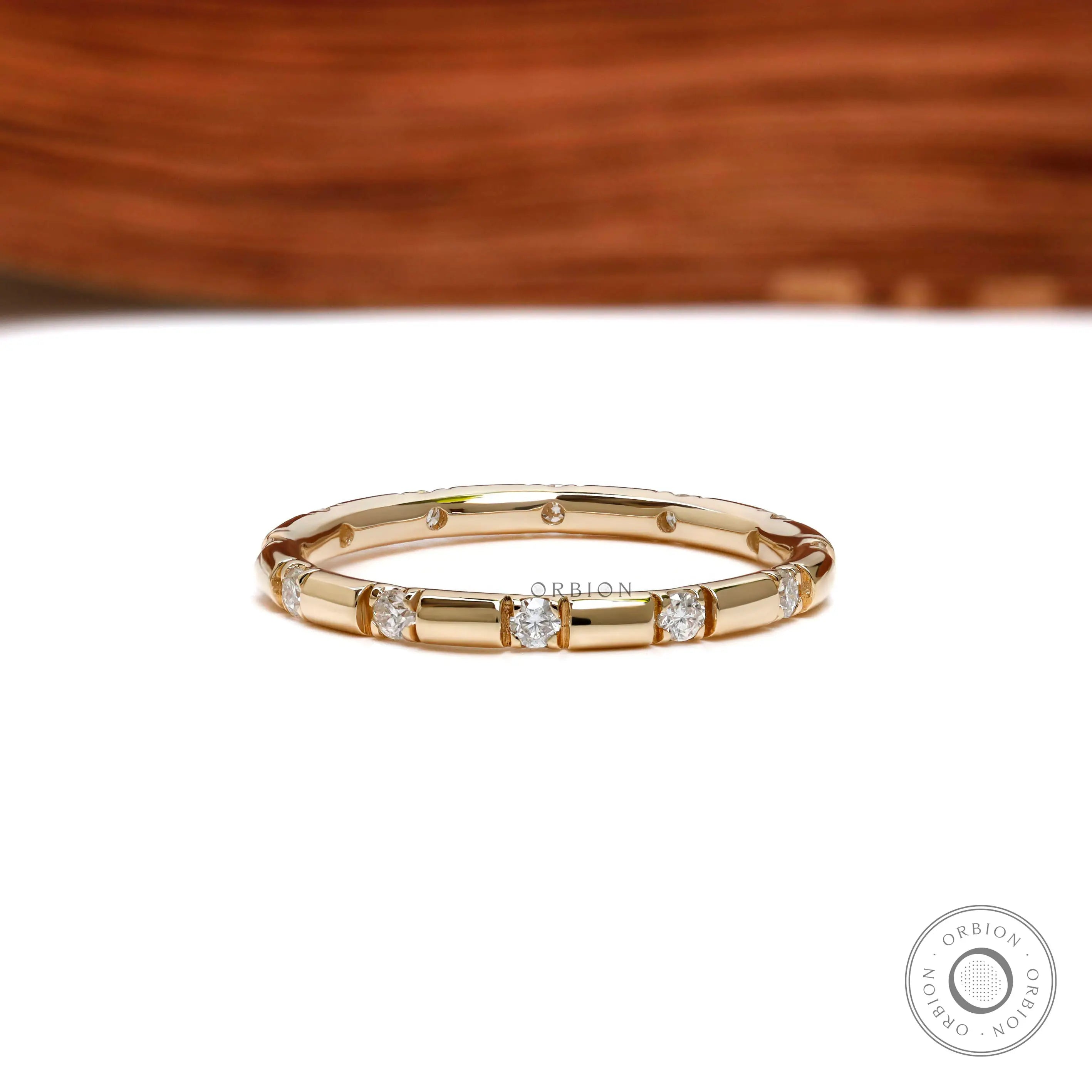 2 mm lab diamond stacking band with round brilliant stones close up