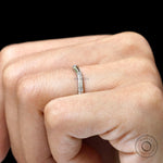 Brilliant cut round lab diamond curved band close up