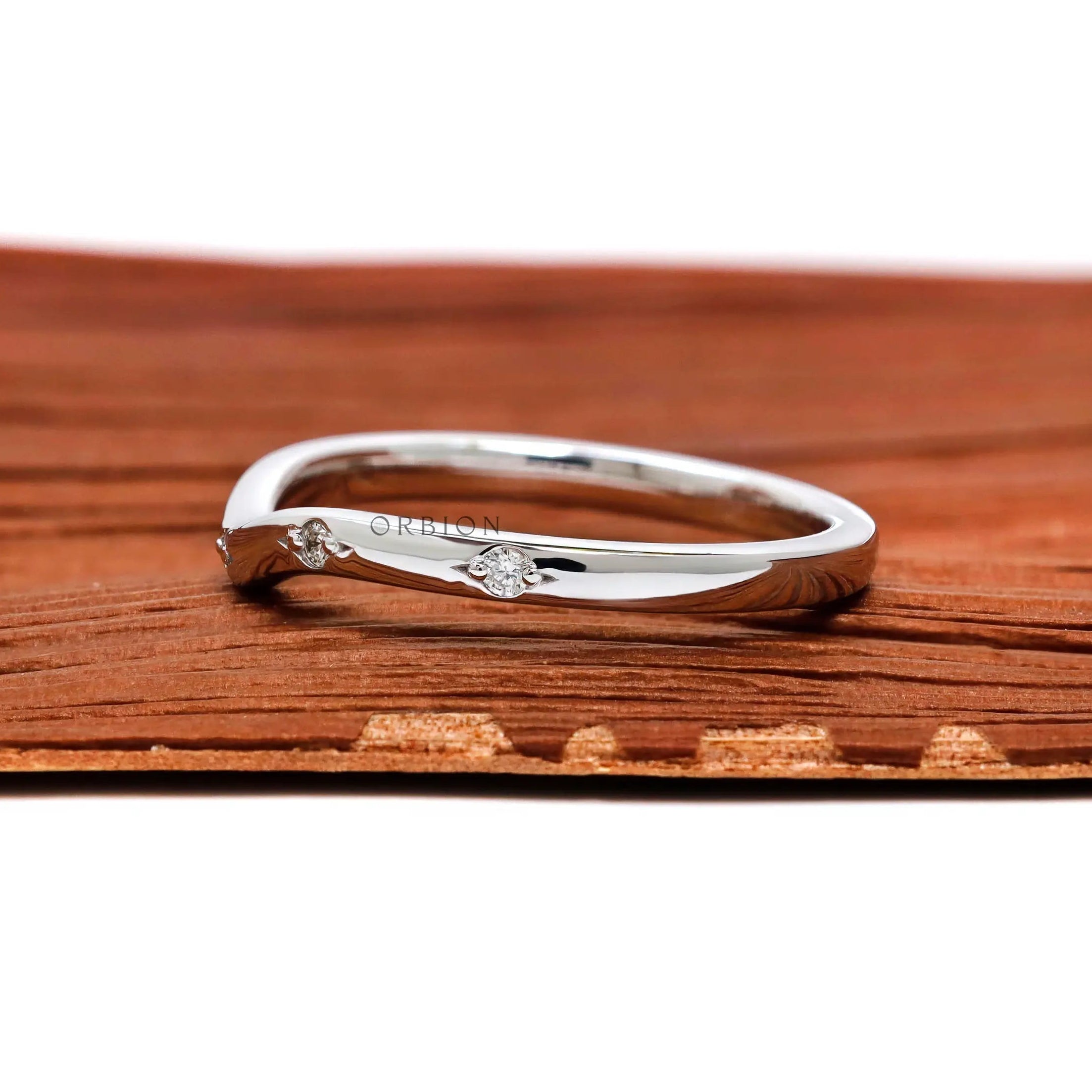 Thin white gold nesting wedding band side view