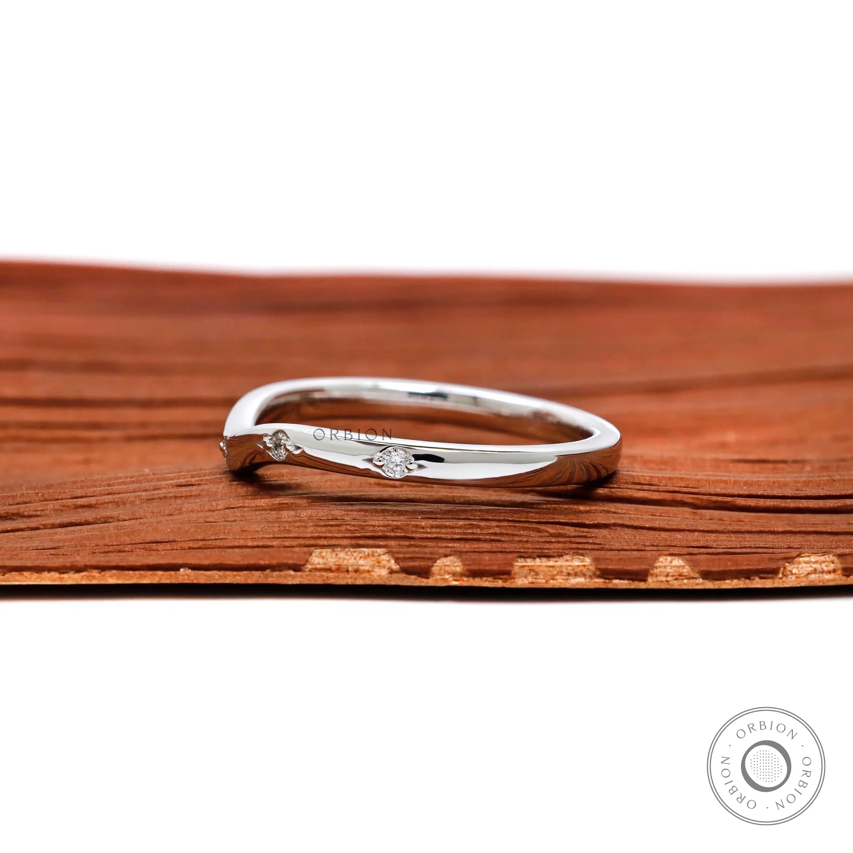 Thin white gold nesting wedding band side view