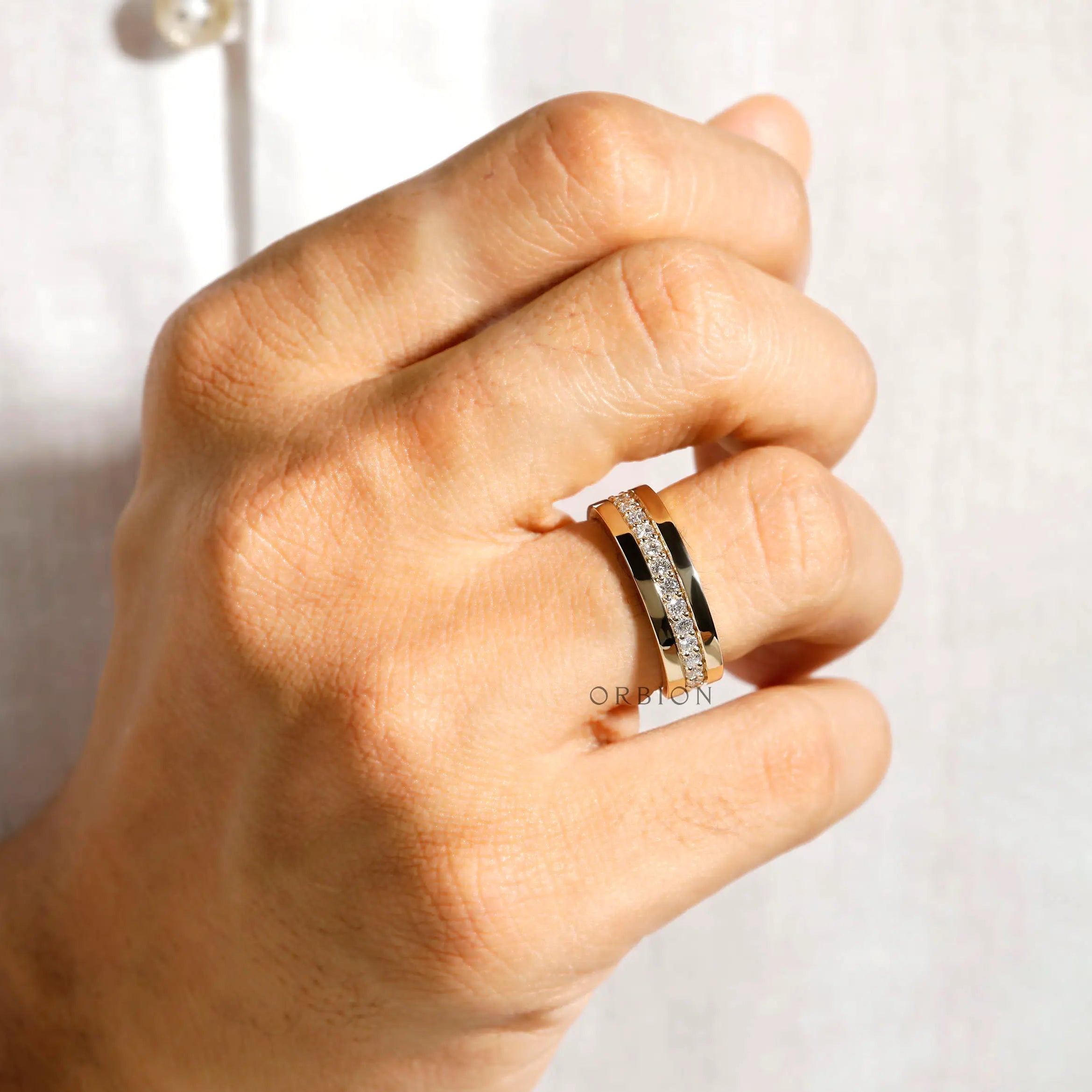 Contemporary 18K gold eternity wedding band for him