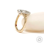 Moval engagement ring with hidden ruby inseam stone
