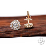 Floral halo diamond studs in yellow gold lifestyle shot