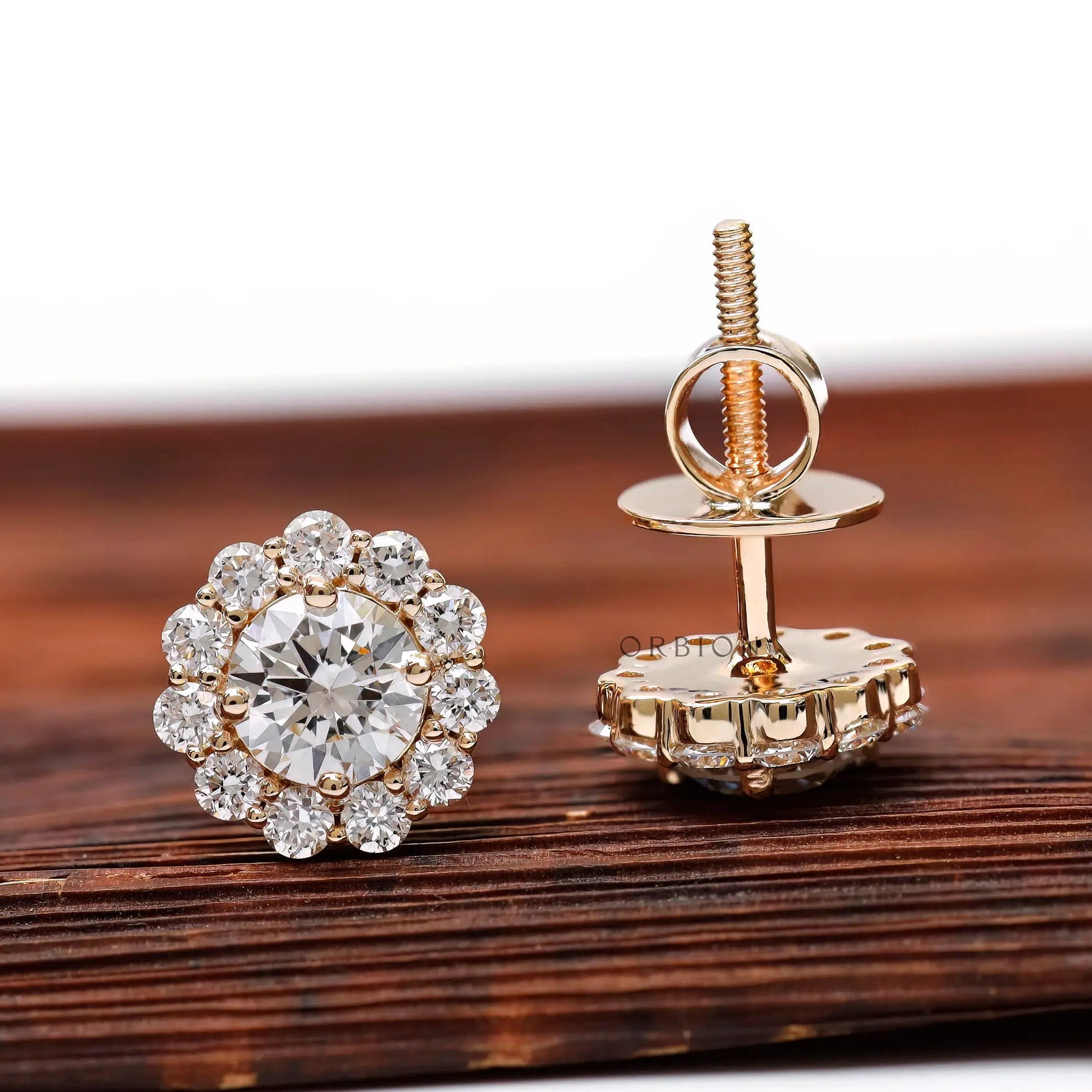 Floral halo diamond studs in yellow gold lifestyle shot