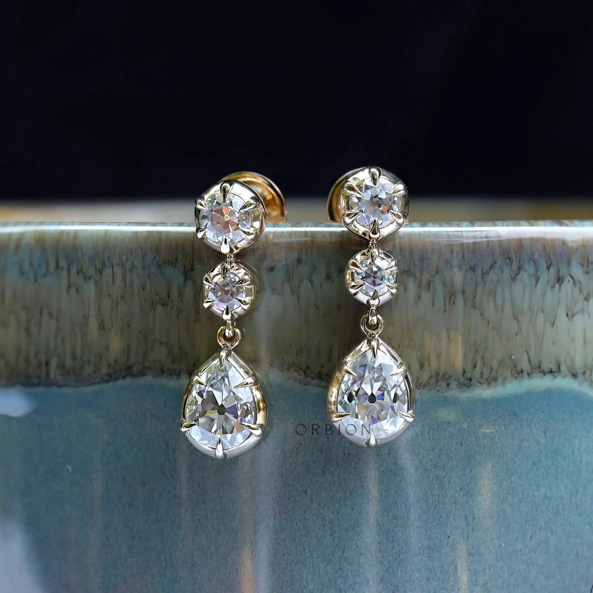 Old mine cut pear and round moissanite dangle earrings