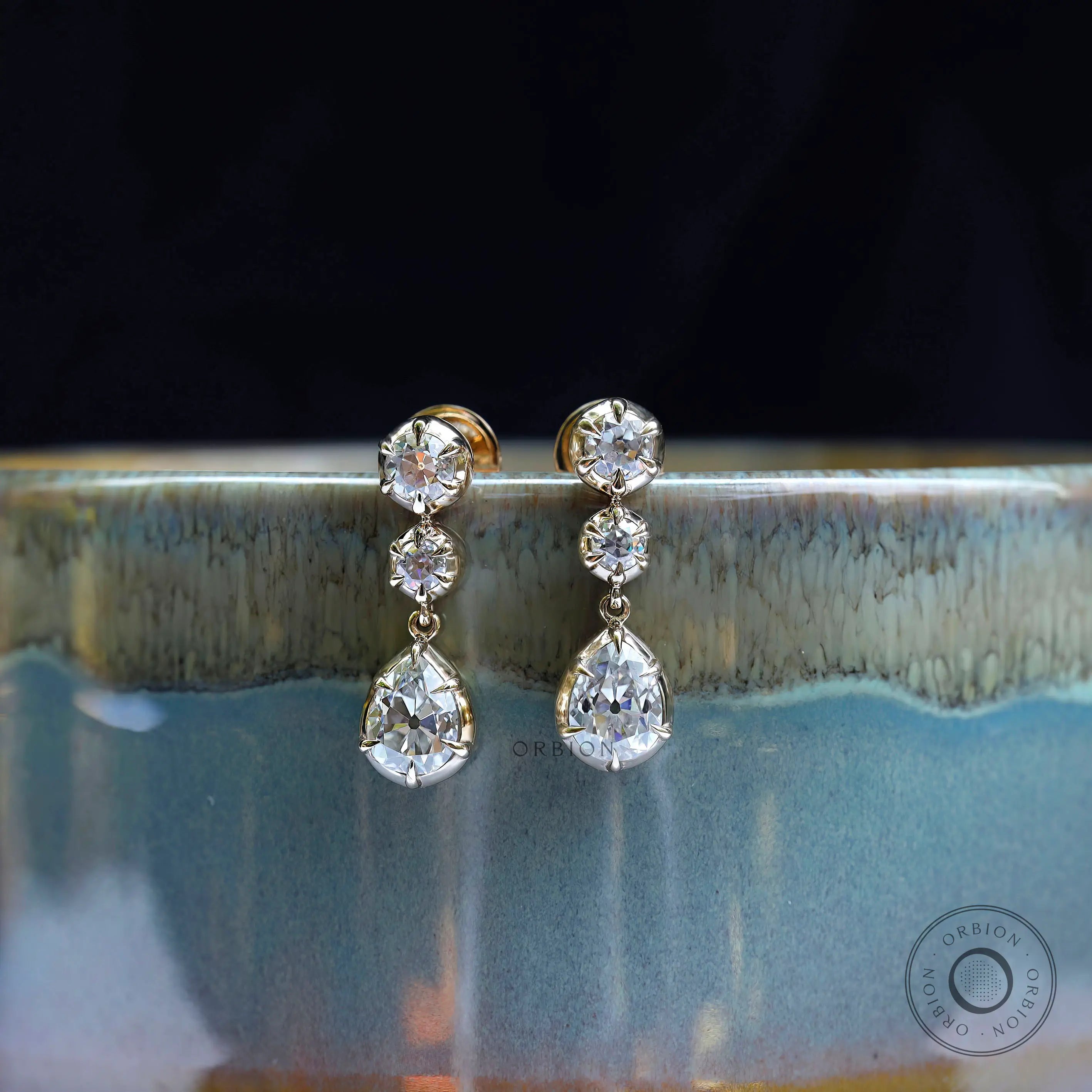 Old mine cut pear and round moissanite dangle earrings